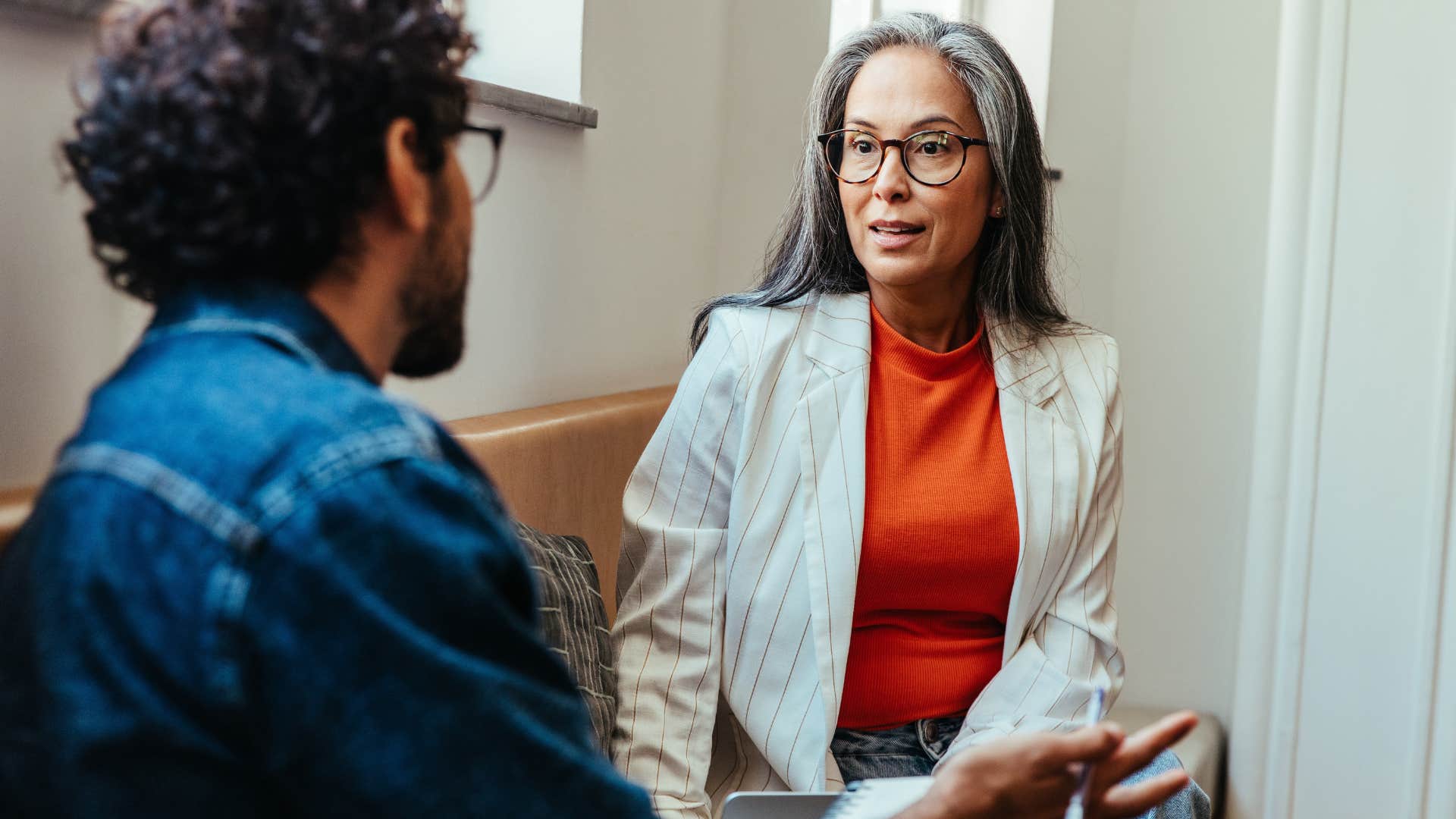 woman telling employee let's bring in this person to serve as your point of contact at work