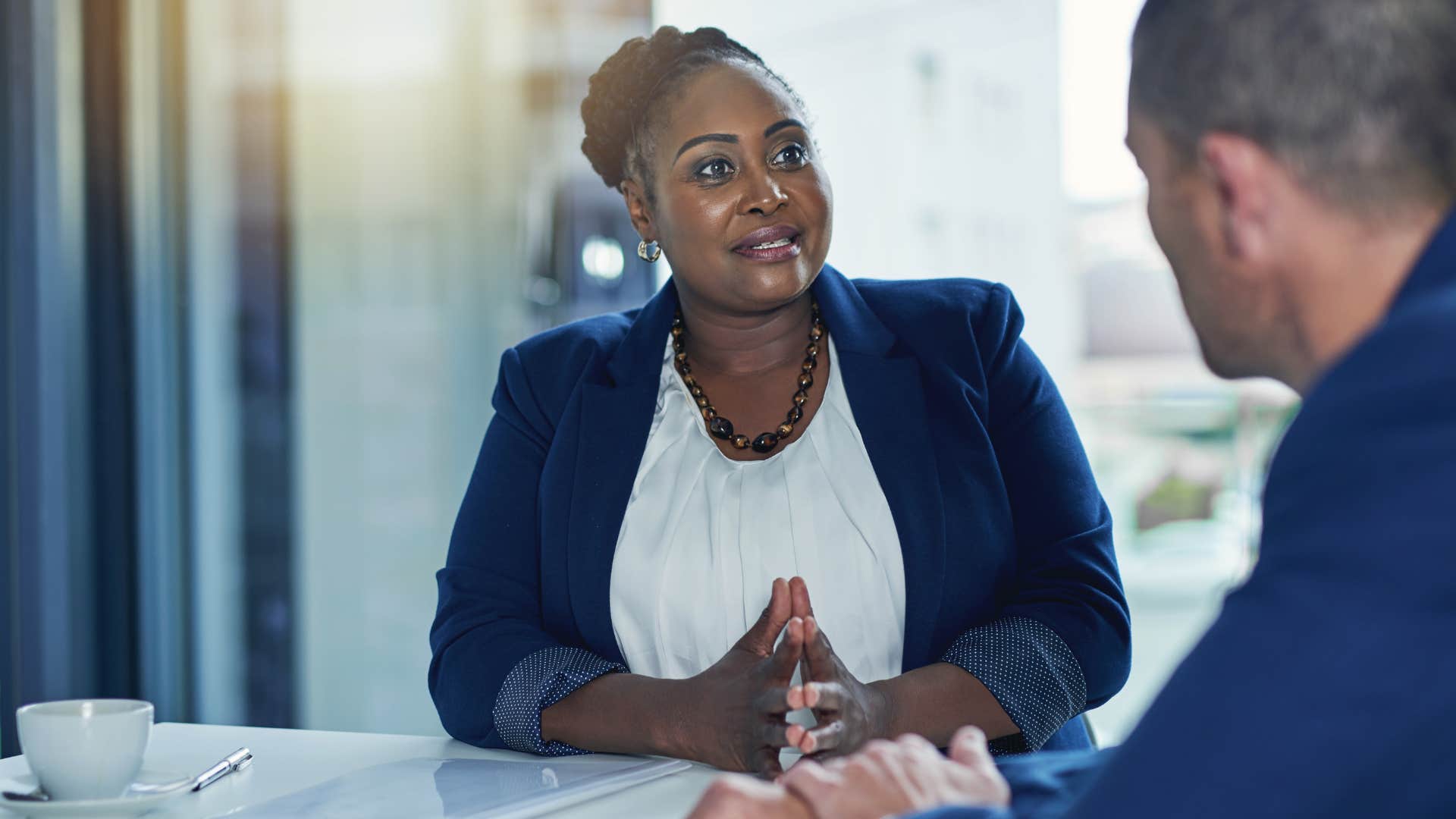 friendly woman telling colleague I choose kindness on purpose