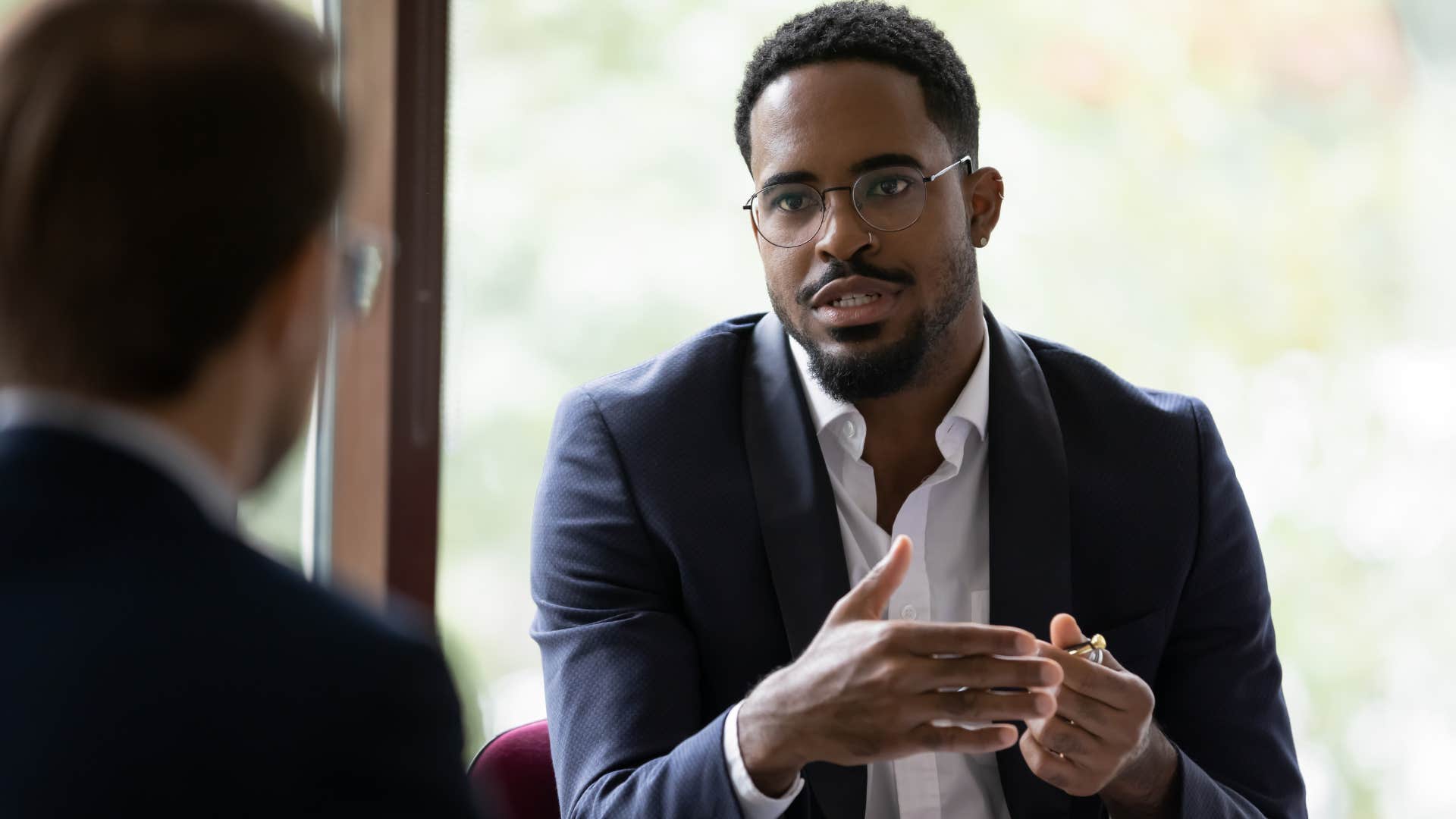 serious man telling colleague I expect to be treated with respect