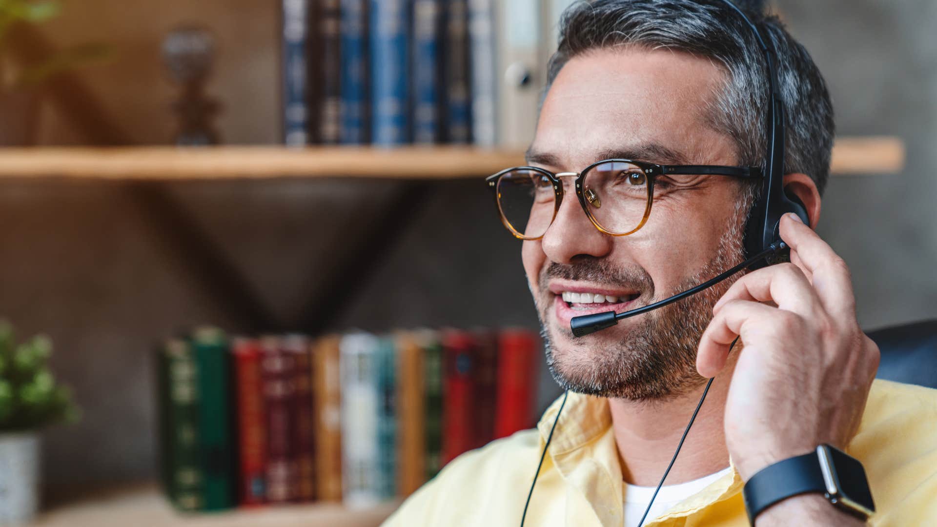 professional man on headset telling colleagues I'm willing to collaborate with you