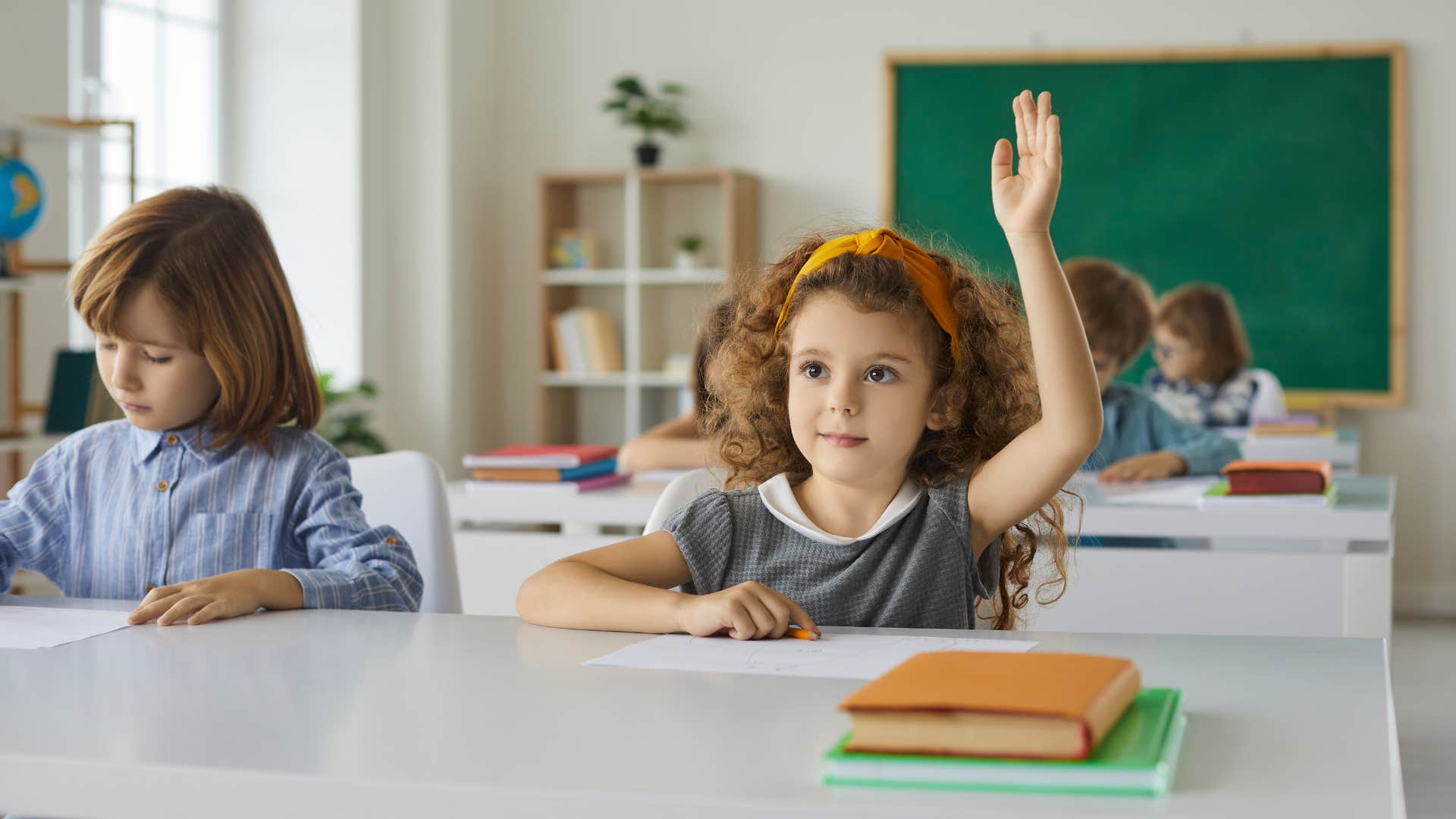 a little school girl asks her teacher if she can repeat the question