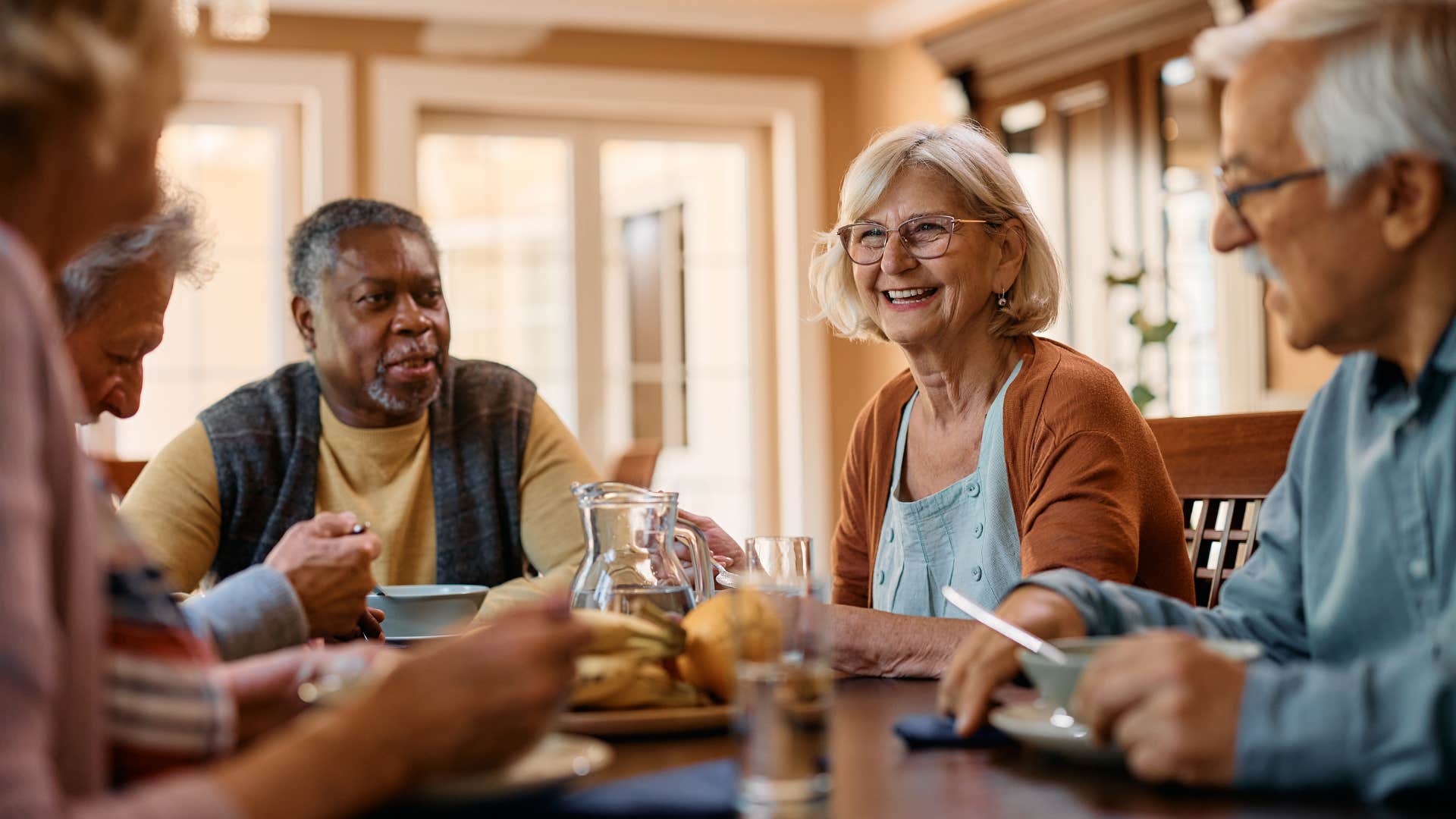 an elderly woman asks another woman if she could repeat what she said