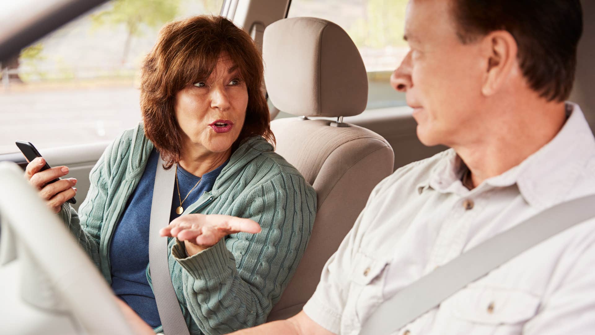 a woman makes sure her and her husband are on the same page when she is ordering food over the phone