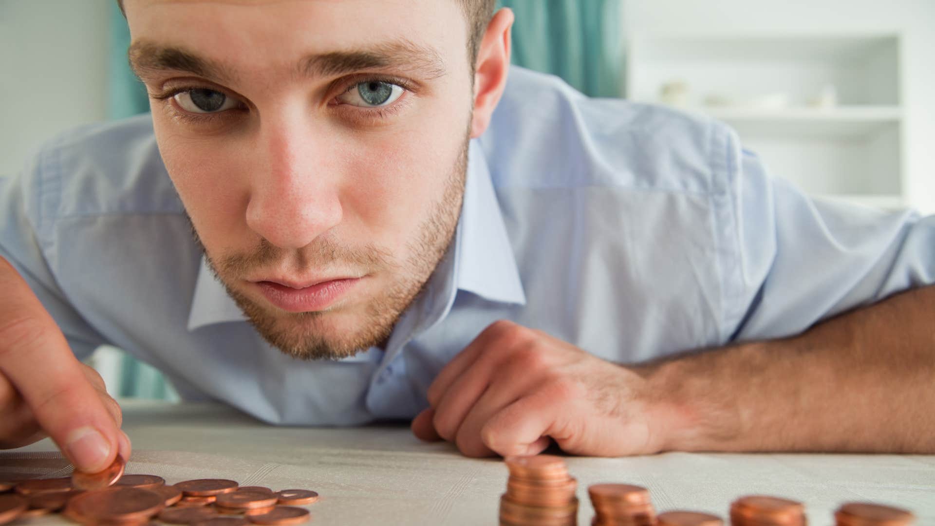 financially unstable man saving money for something