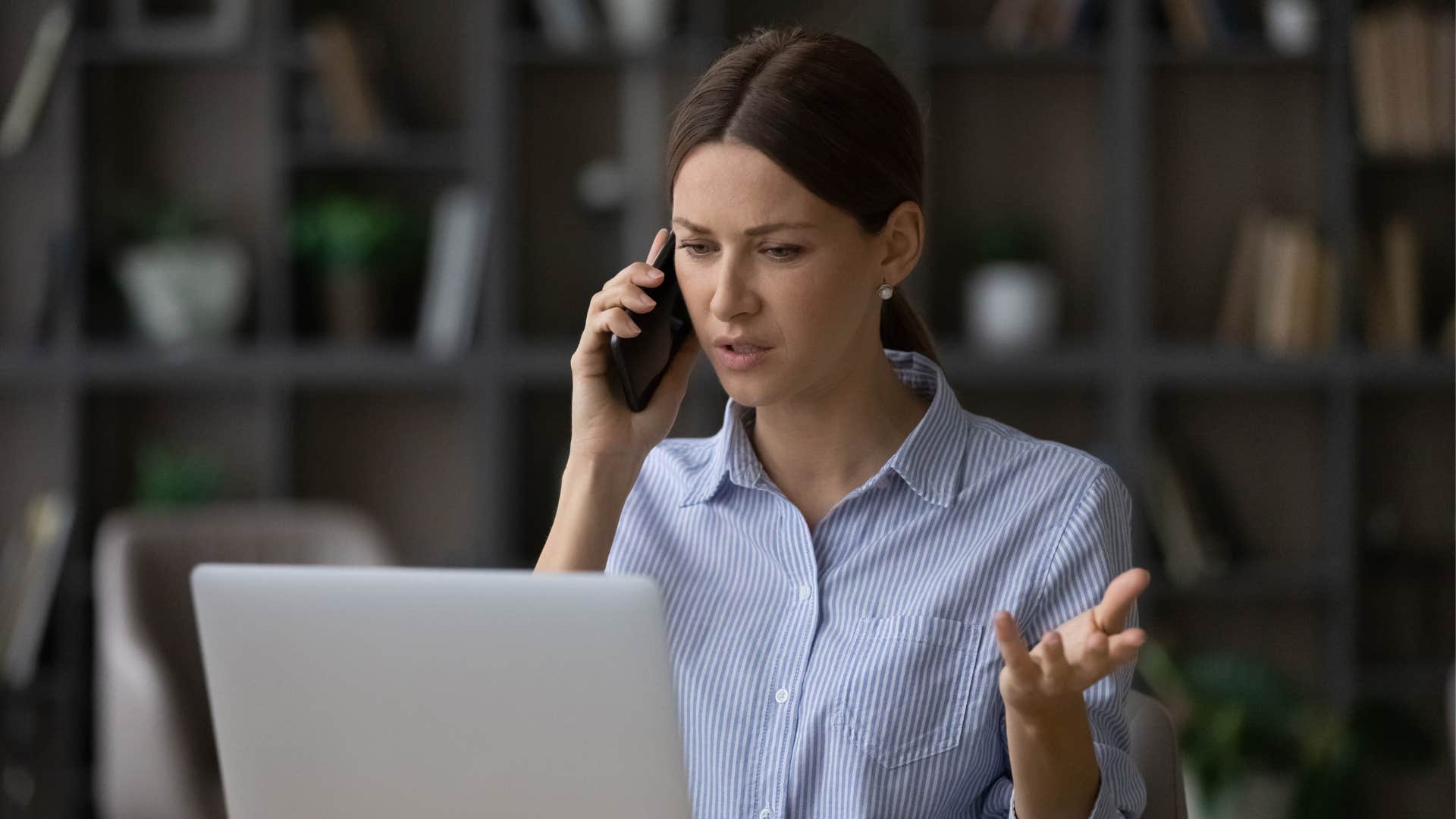 woman telling her friend on the phone that she wont buy something
