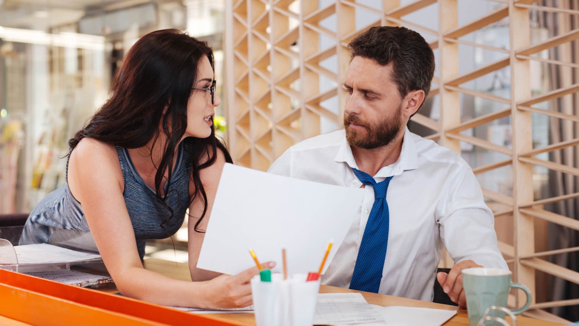 woman confronting lazy worker who says hes been busy all day