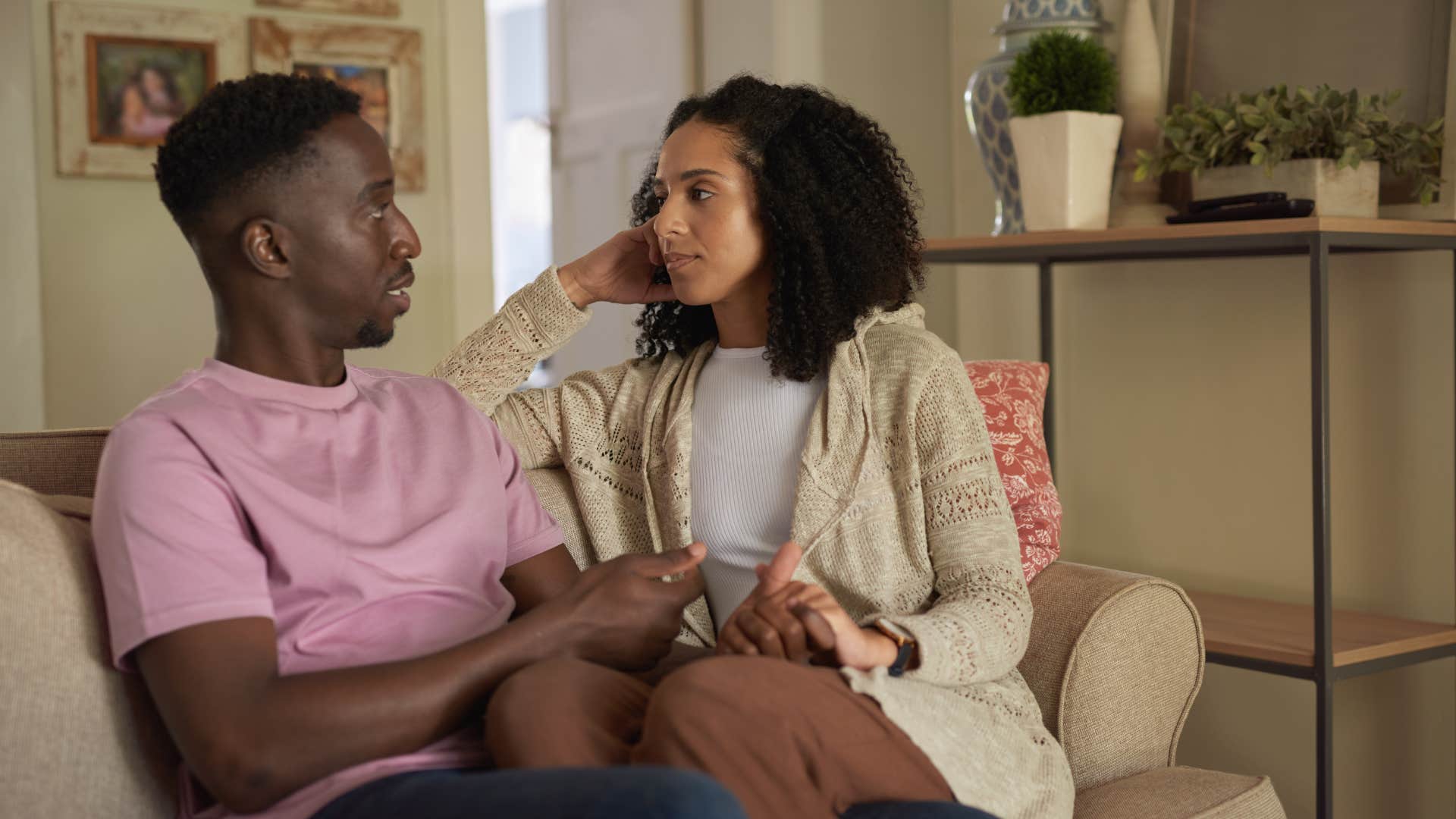 man in pink shirt holding woman as he admits he misses how thing used to be
