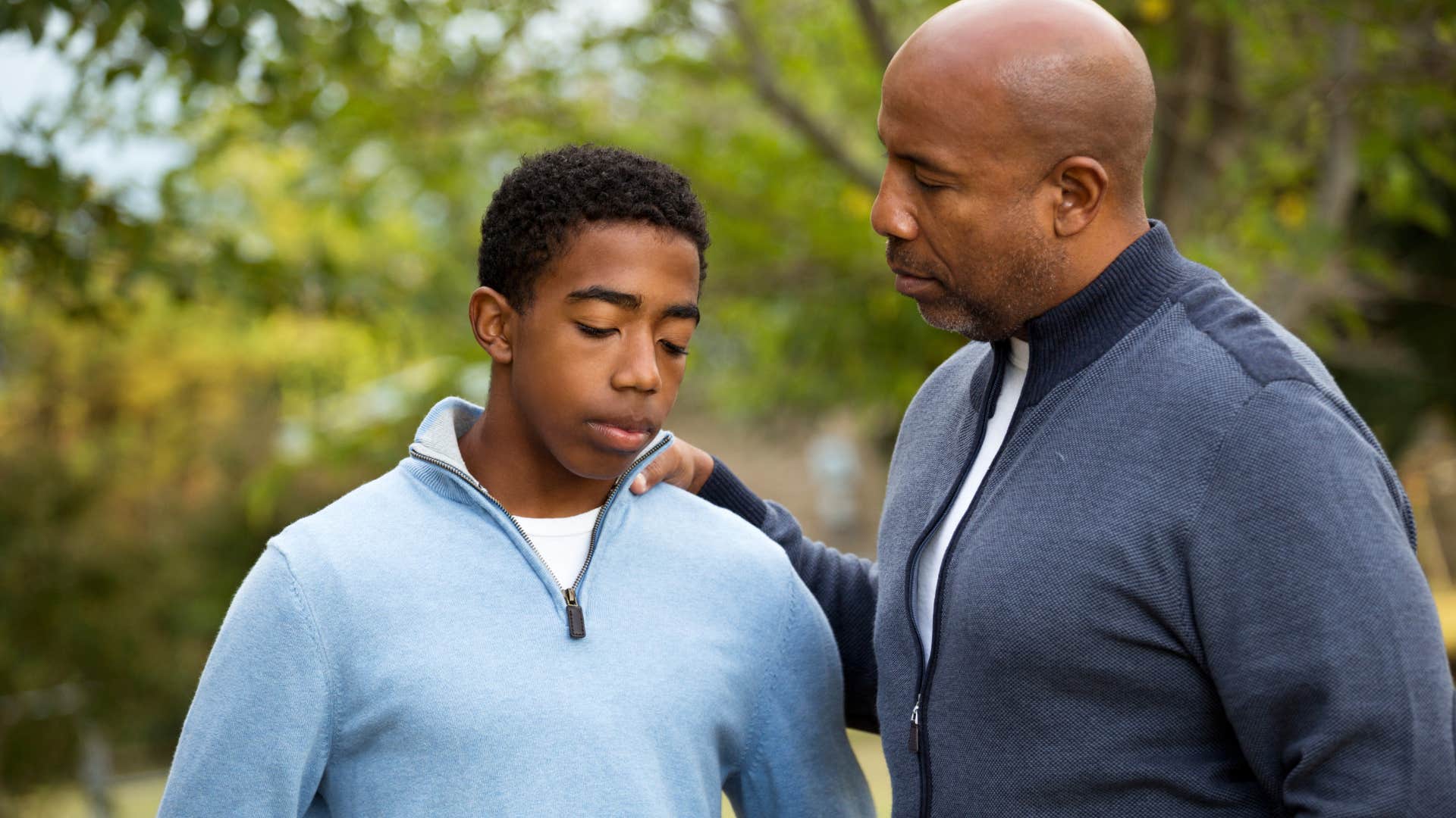 miserable man saying I'm used to it to his teenage son