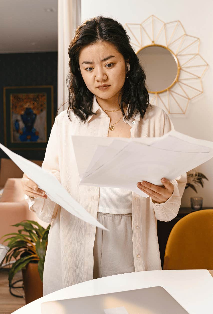woman looking confused at sketchy phrasing in job description