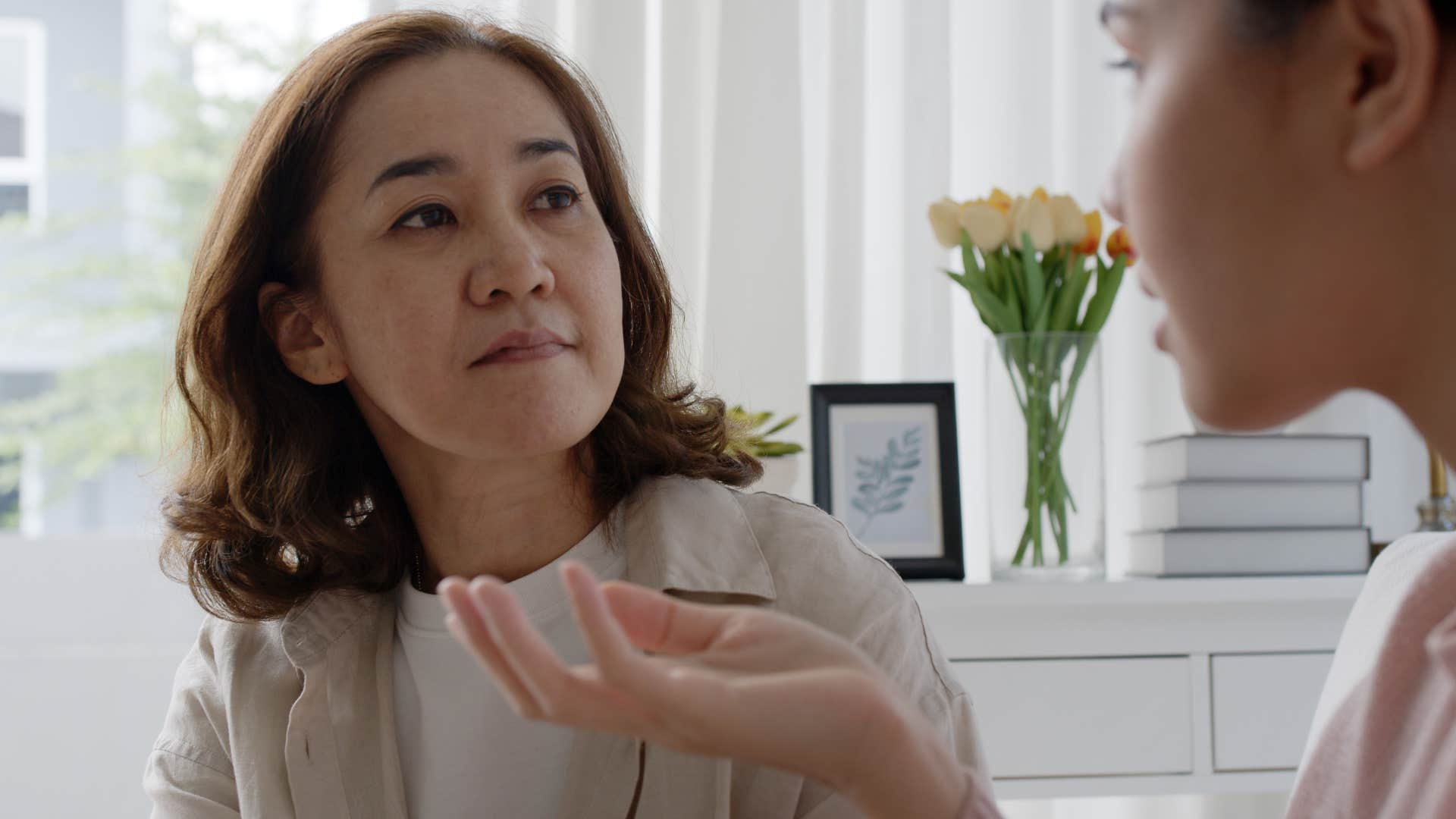 woman saying you got lucky to her upset adult daughter