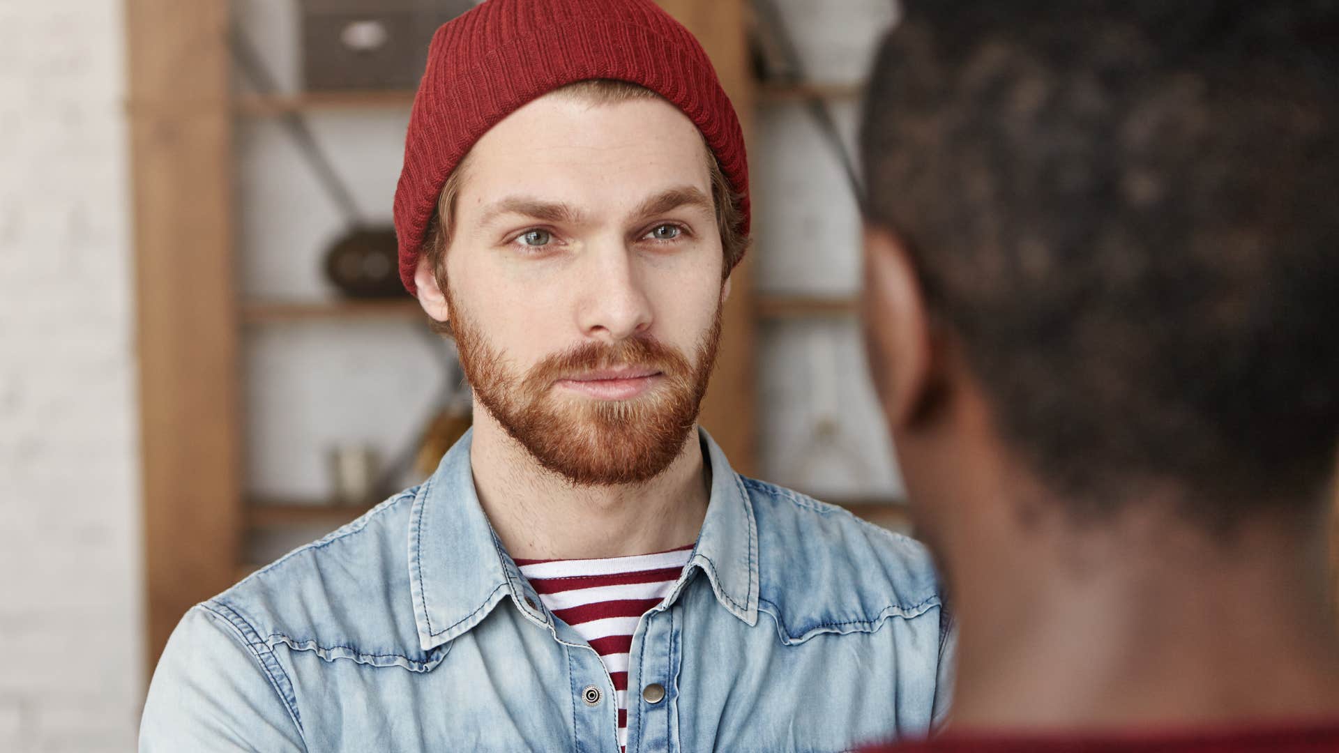 upset man saying that's not my job to co-worker