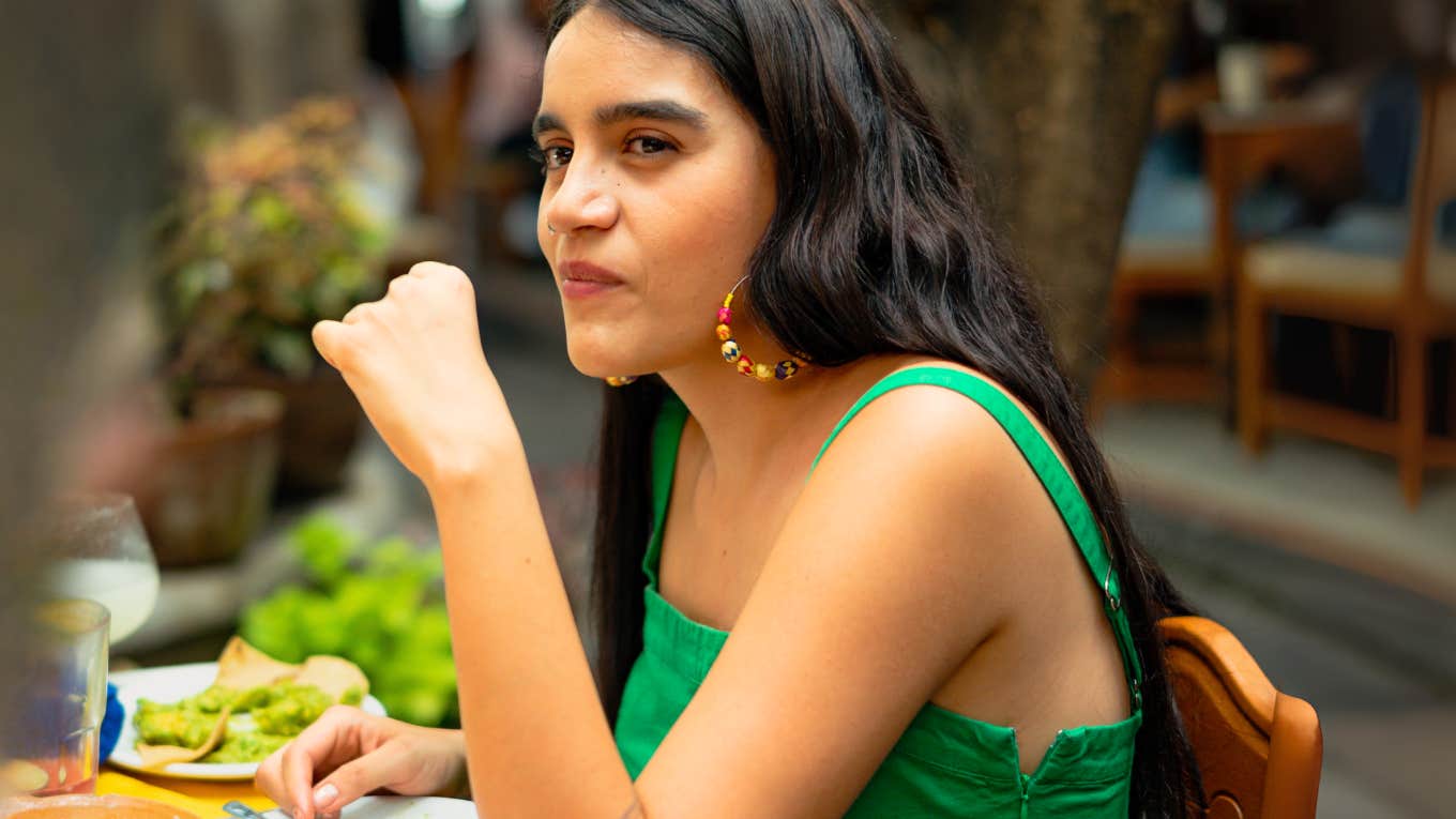 Person talking to waitstaff giving away their lack of social intelligence. 