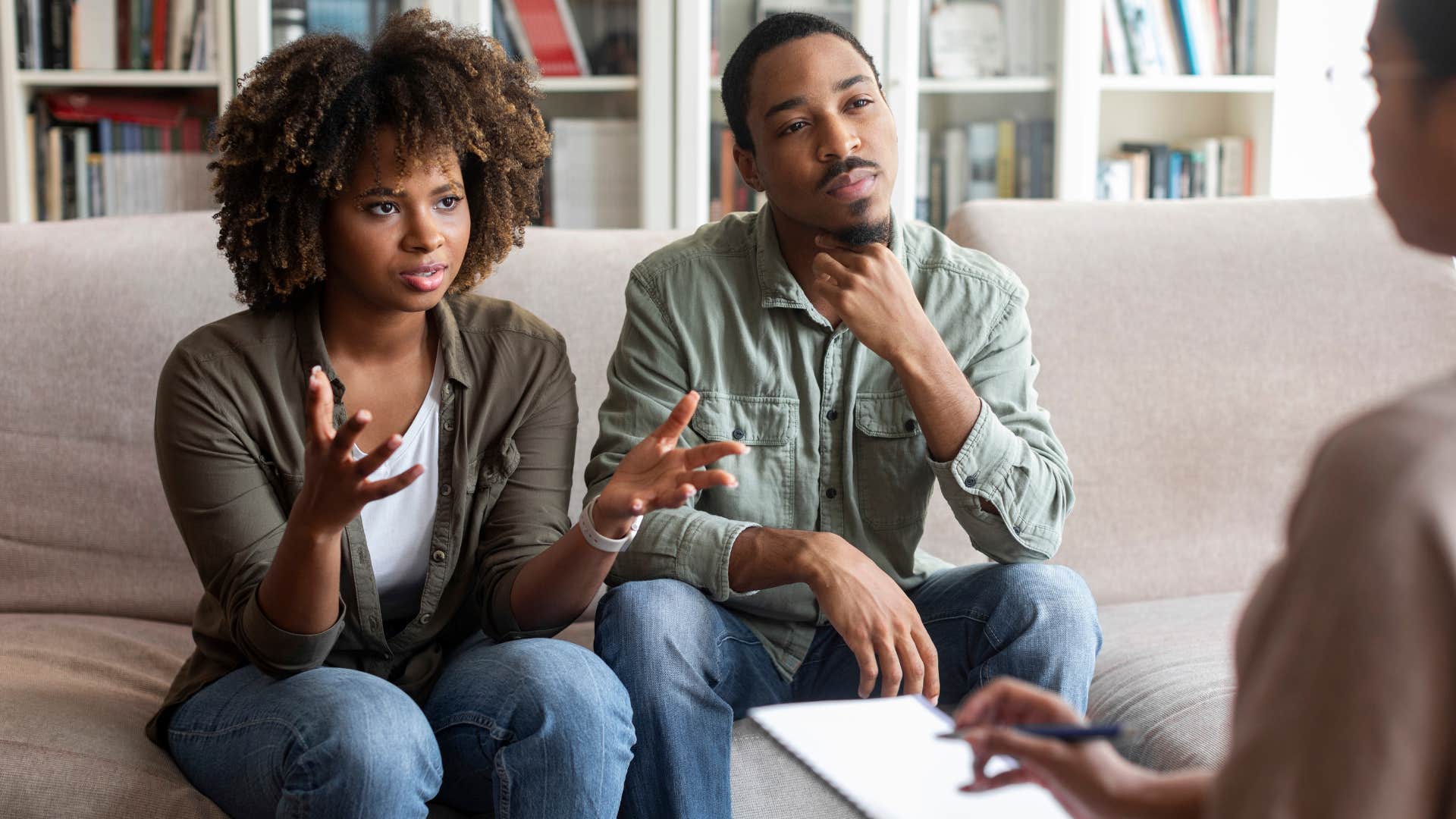 couple in therapy as woman in white shirt complains i feel like roommates