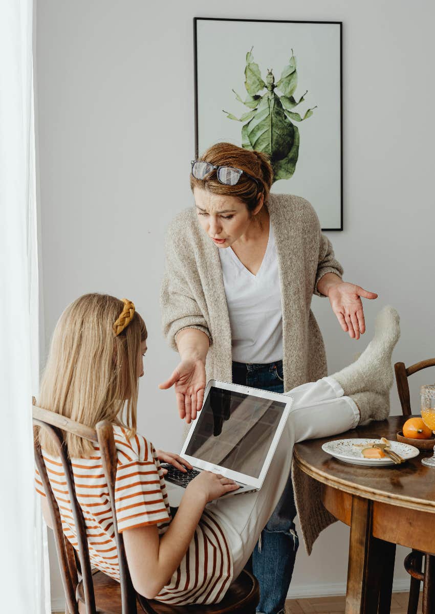 woman scolding her teen daughter who has a bad attitude