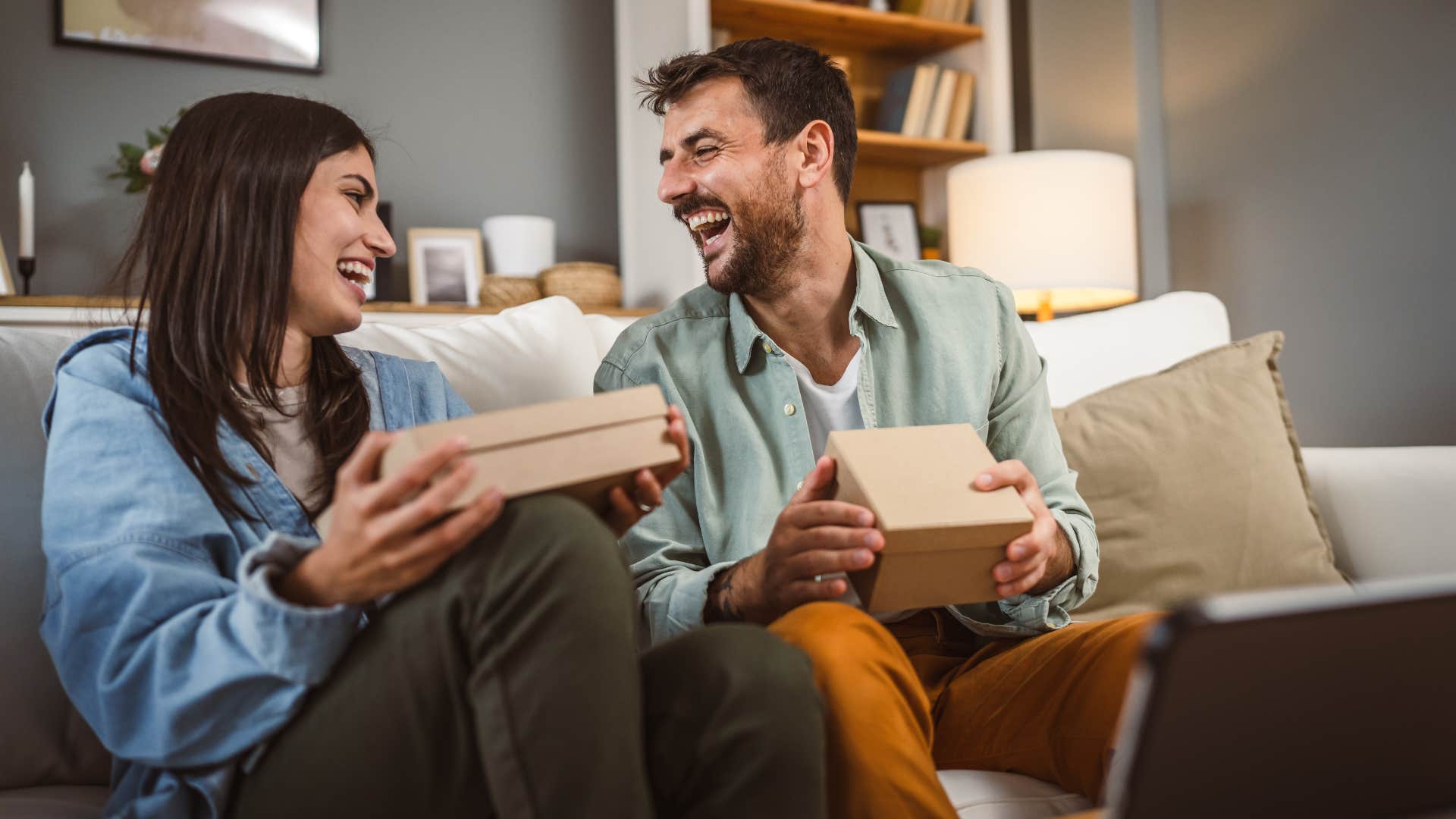 Happy couple exchange gifts