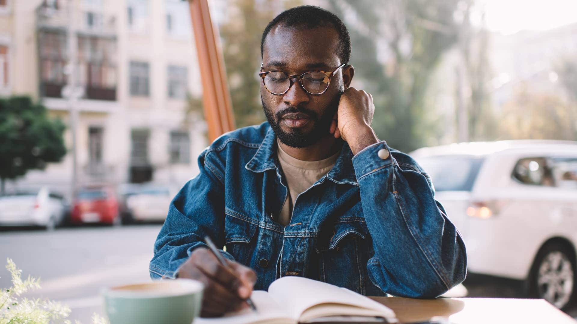 Person writes in day planner to retain information