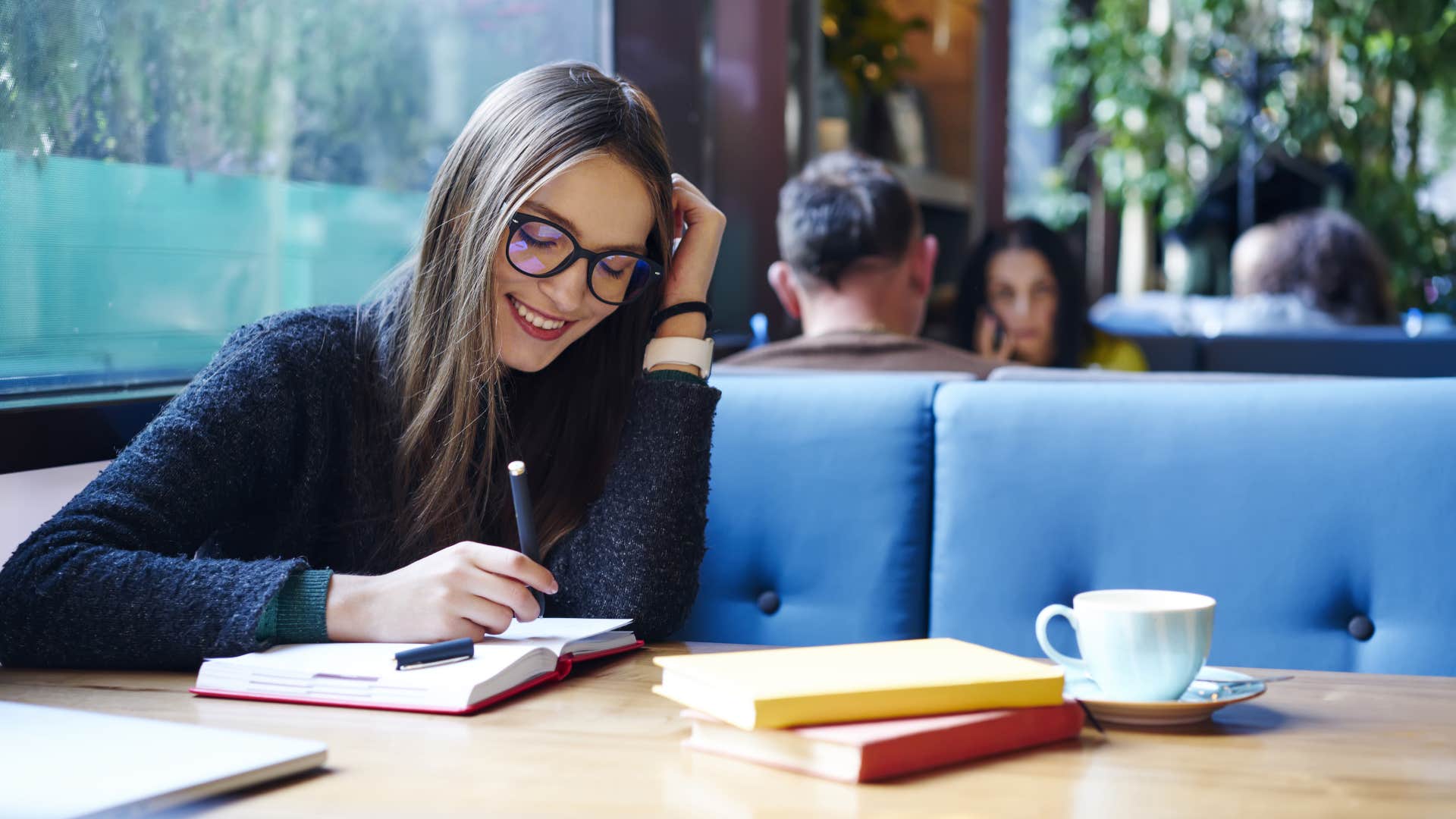 Sensual person writes in day planner