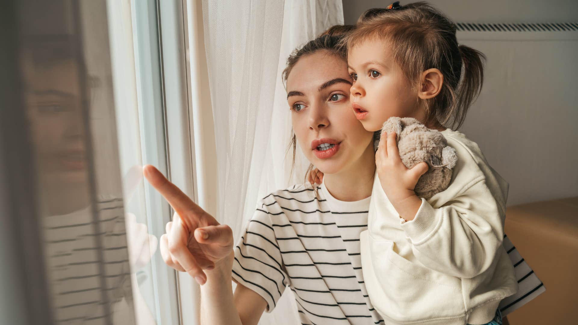 an introverted mother observes what is going on around to her introverted child