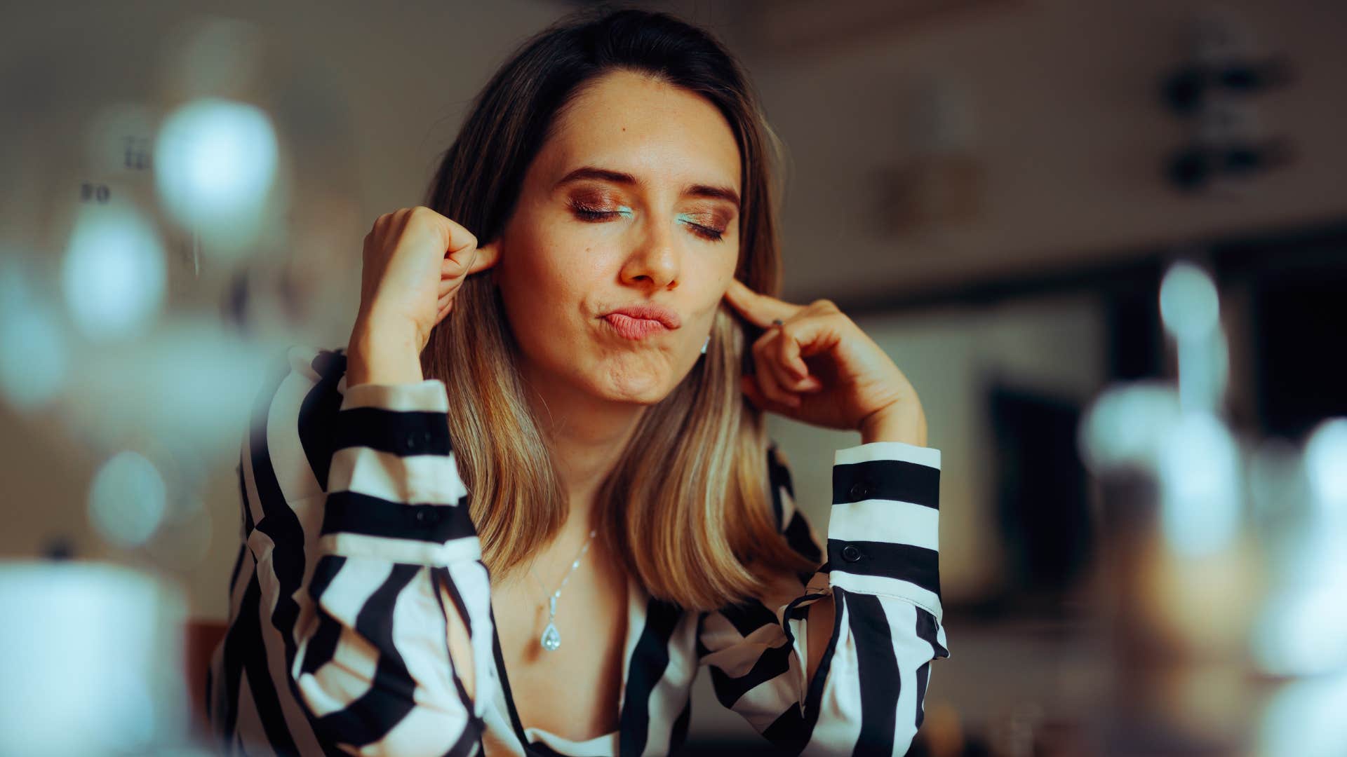 an introverted woman has sound sensory overload in public