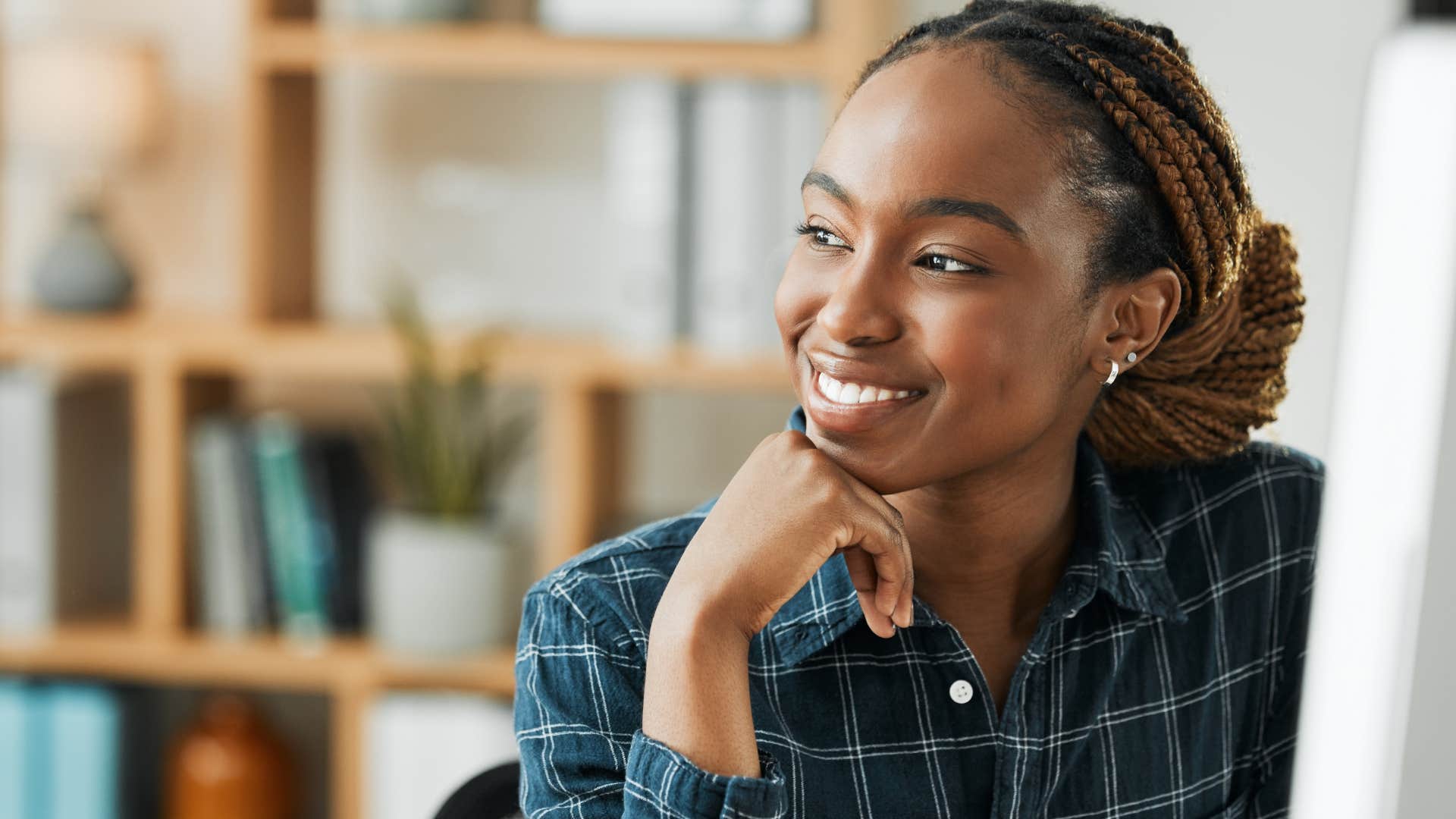 Humble woman smiling at work.
