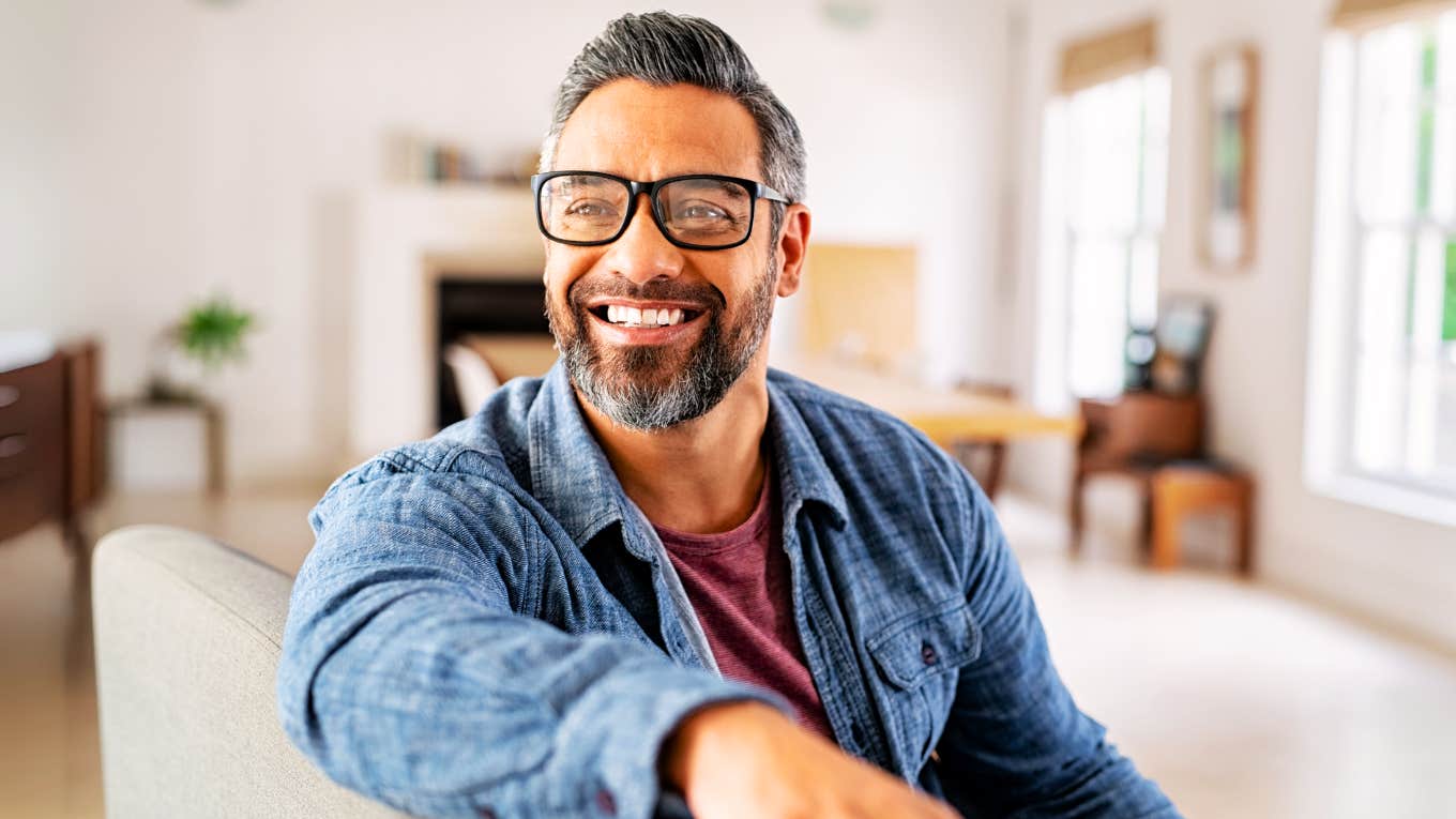 Relationship Habits That Seem Small But Significantly Boost Happiness, According To Psychology Man in a relationship who is significantly happy.