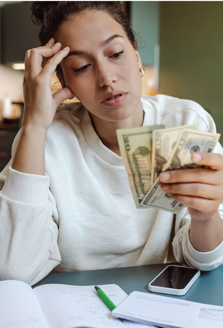 woman thinking about her finances using vibe based budgeting emotions money
