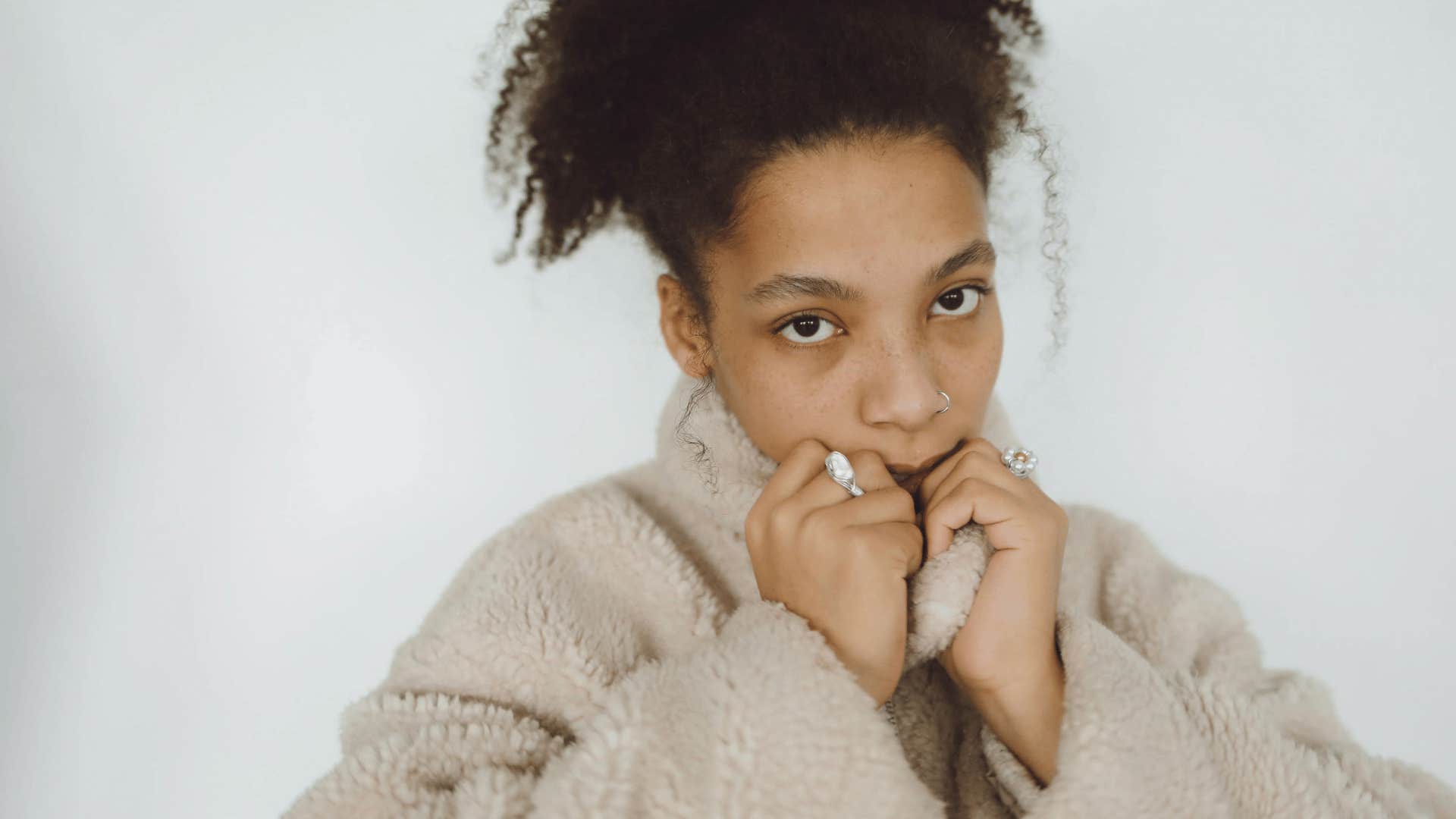serious young woman spiraling into high-volume thinking
