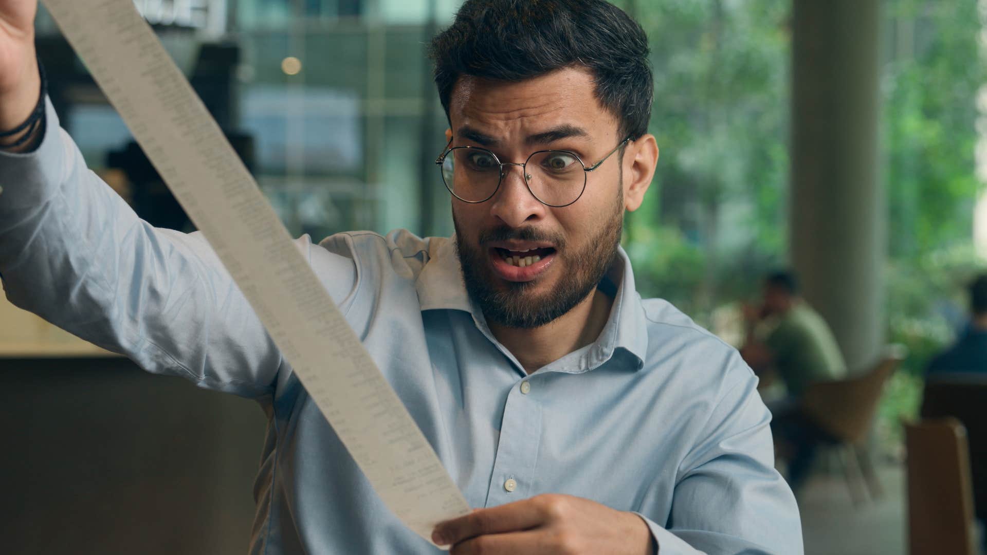 man who isn't good with finances panicking
