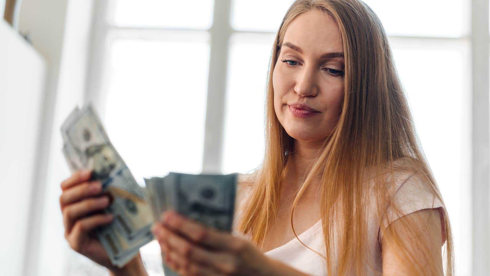 woman who is considering divorce spending lots of money