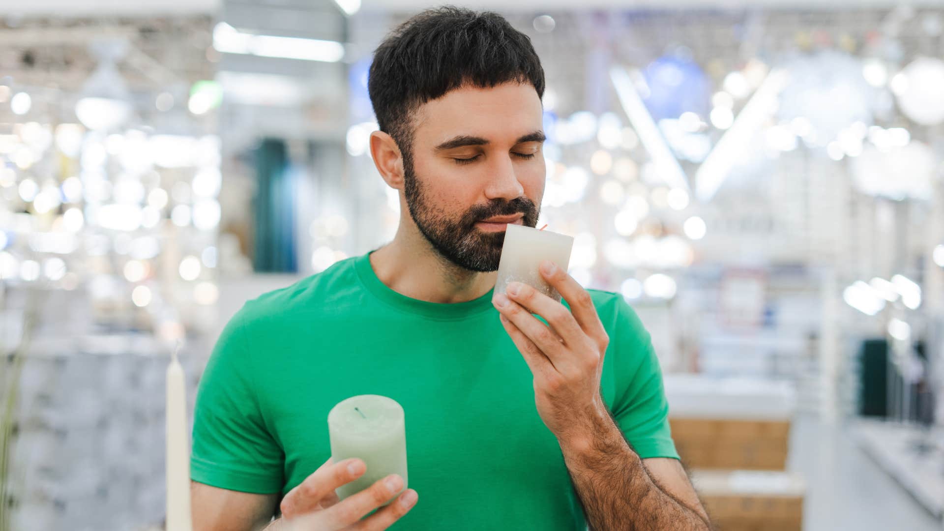 a man smells candles to balance his mood