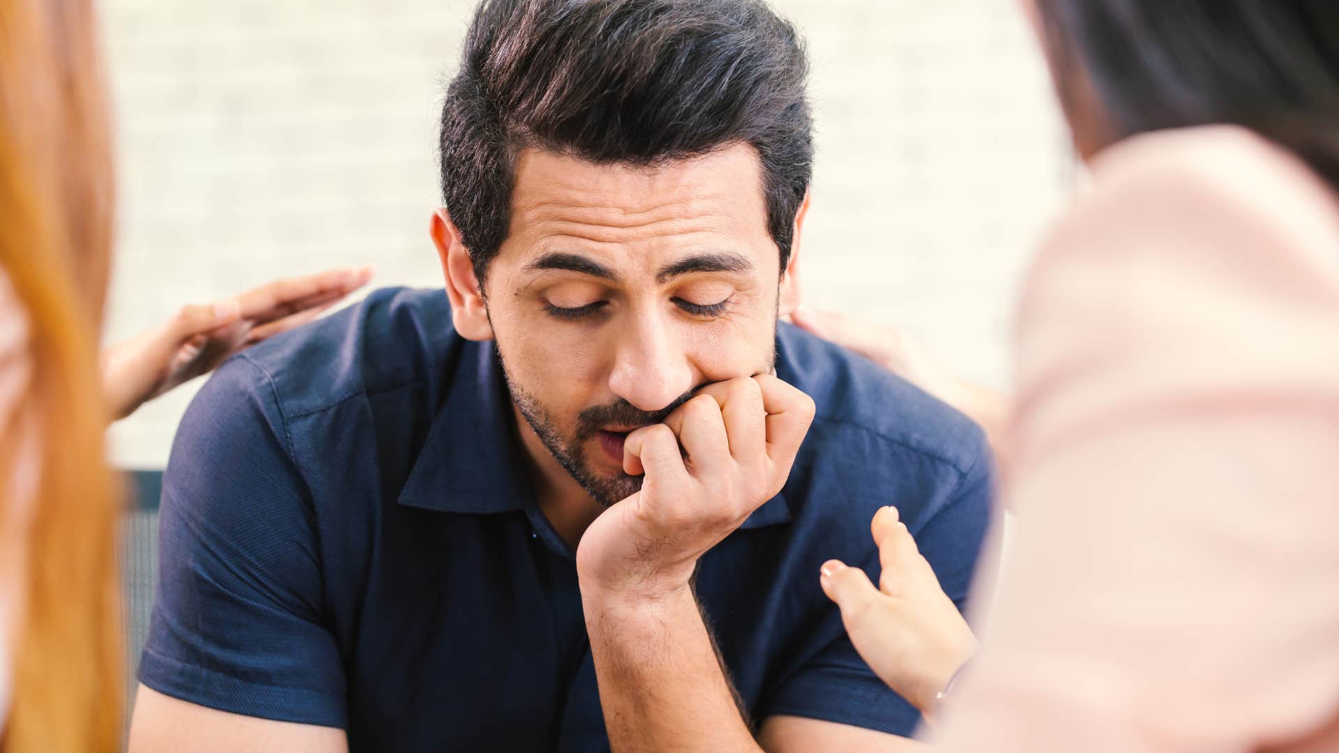man who doesn't like being around gossip being comforted