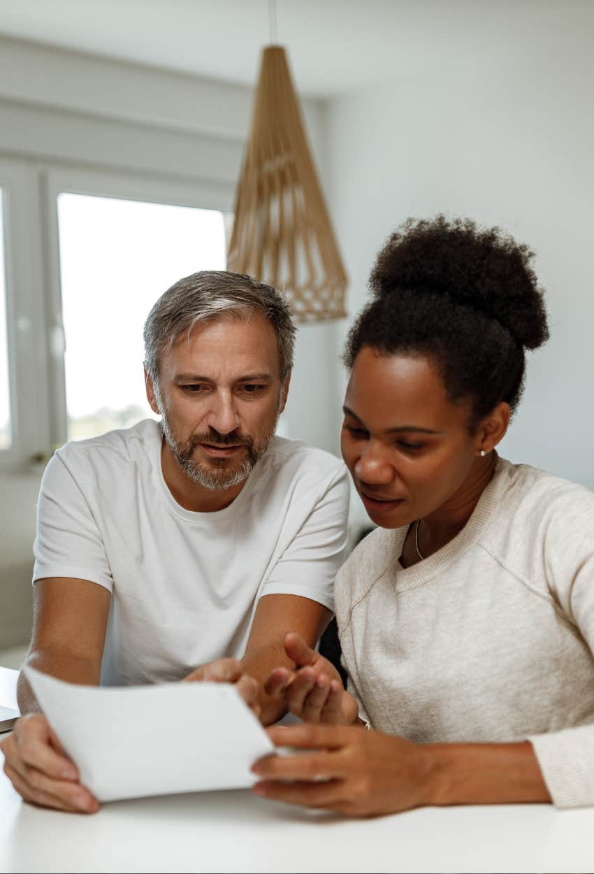 couple discussing splitting a big cost financial red flags show someone keeper