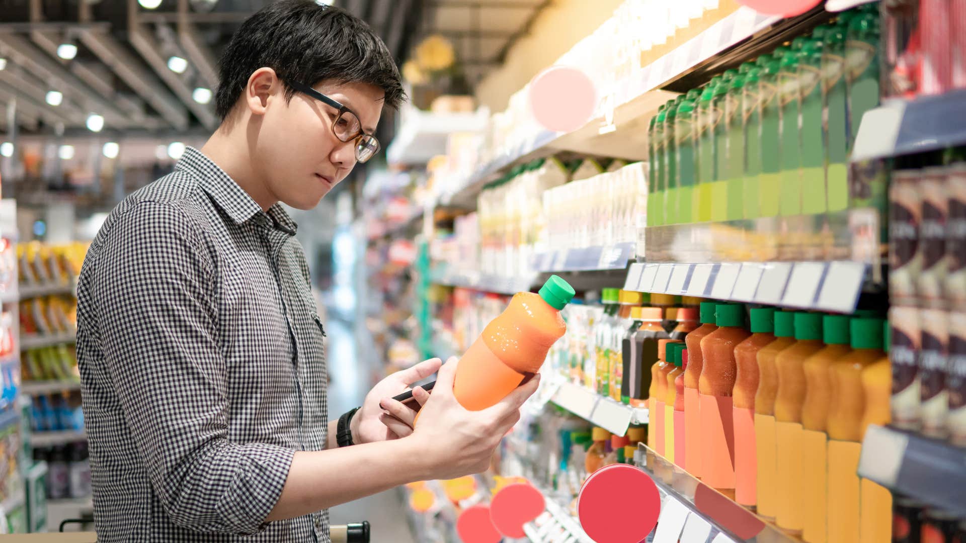 man choosing generic over store-brand in the grocery store