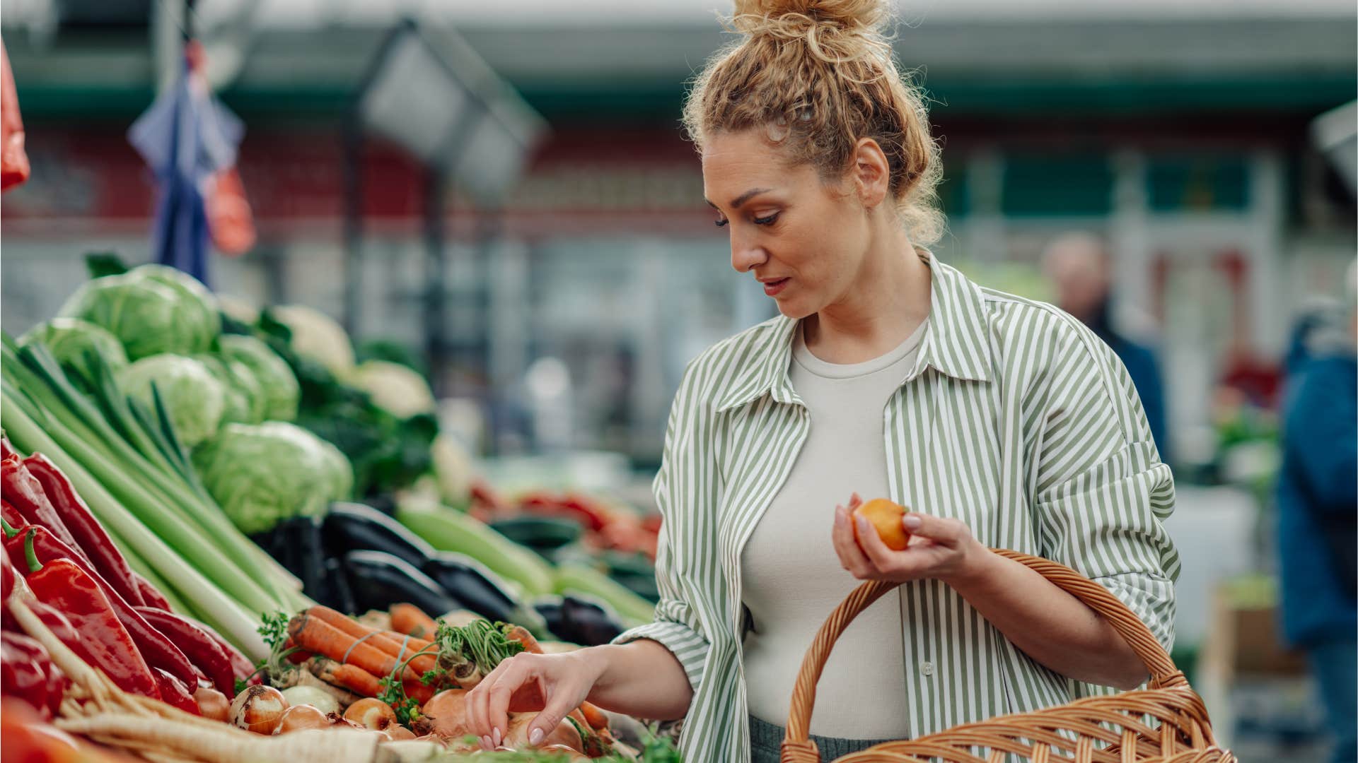 woman looking at seasonal produce