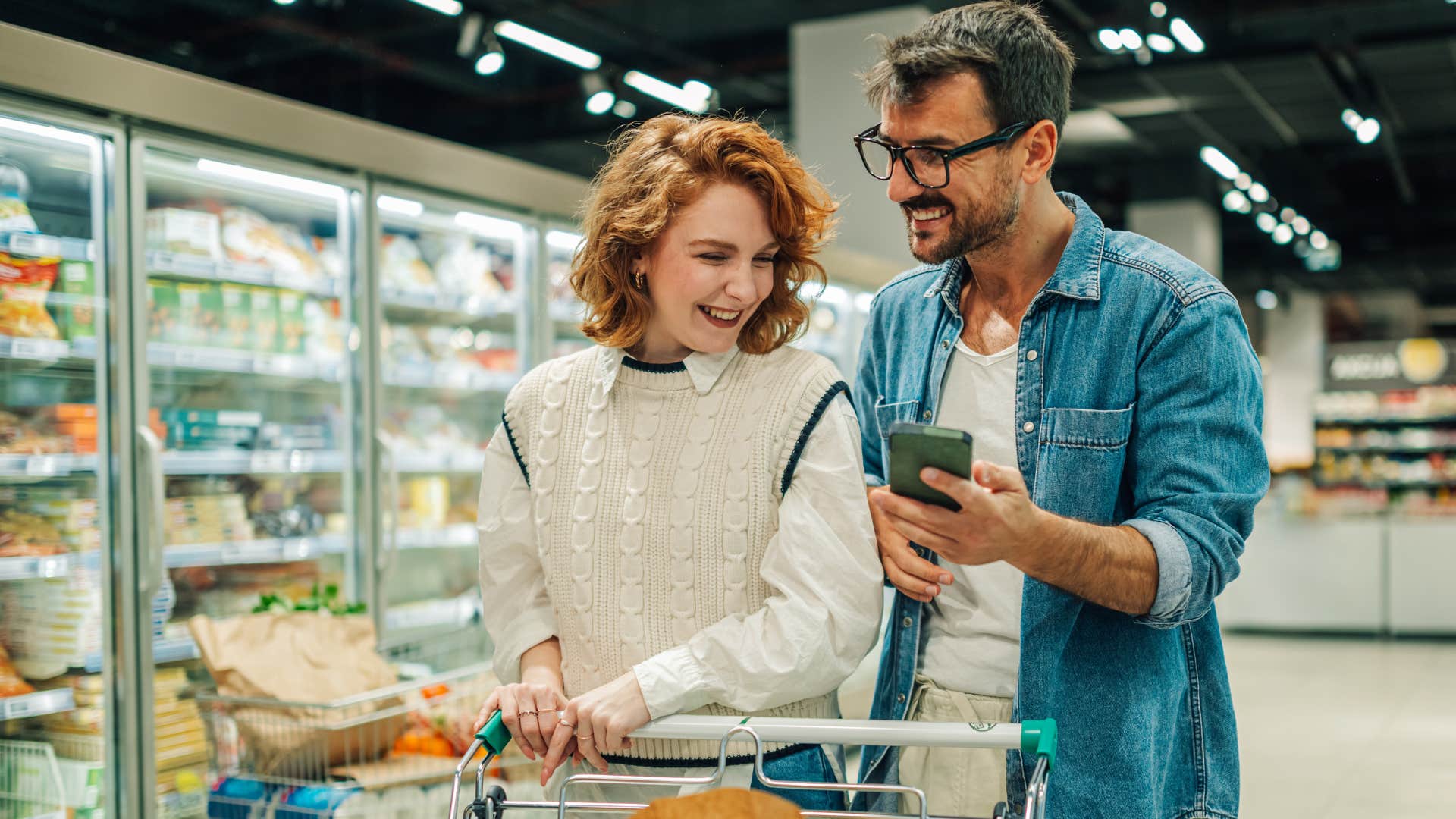 couple walking around grocery store