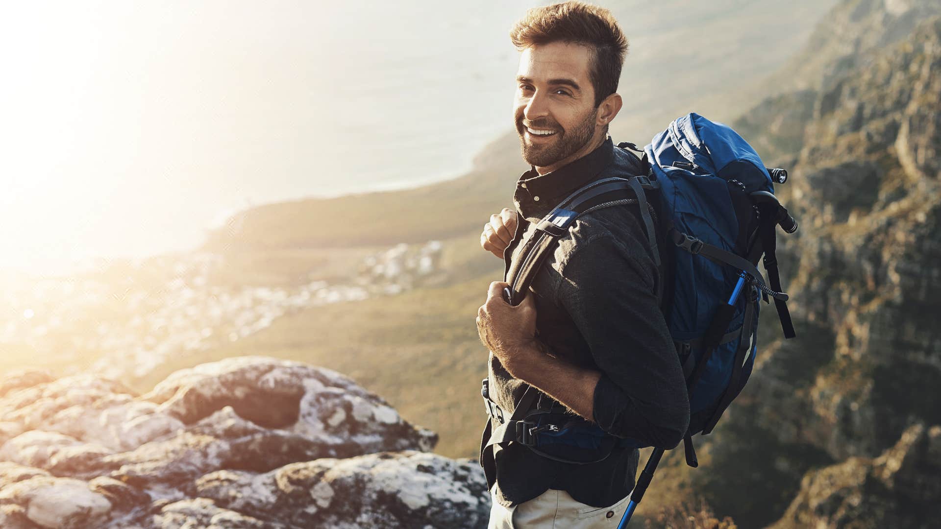 successful man hiking willing to step outside of his comfort zone