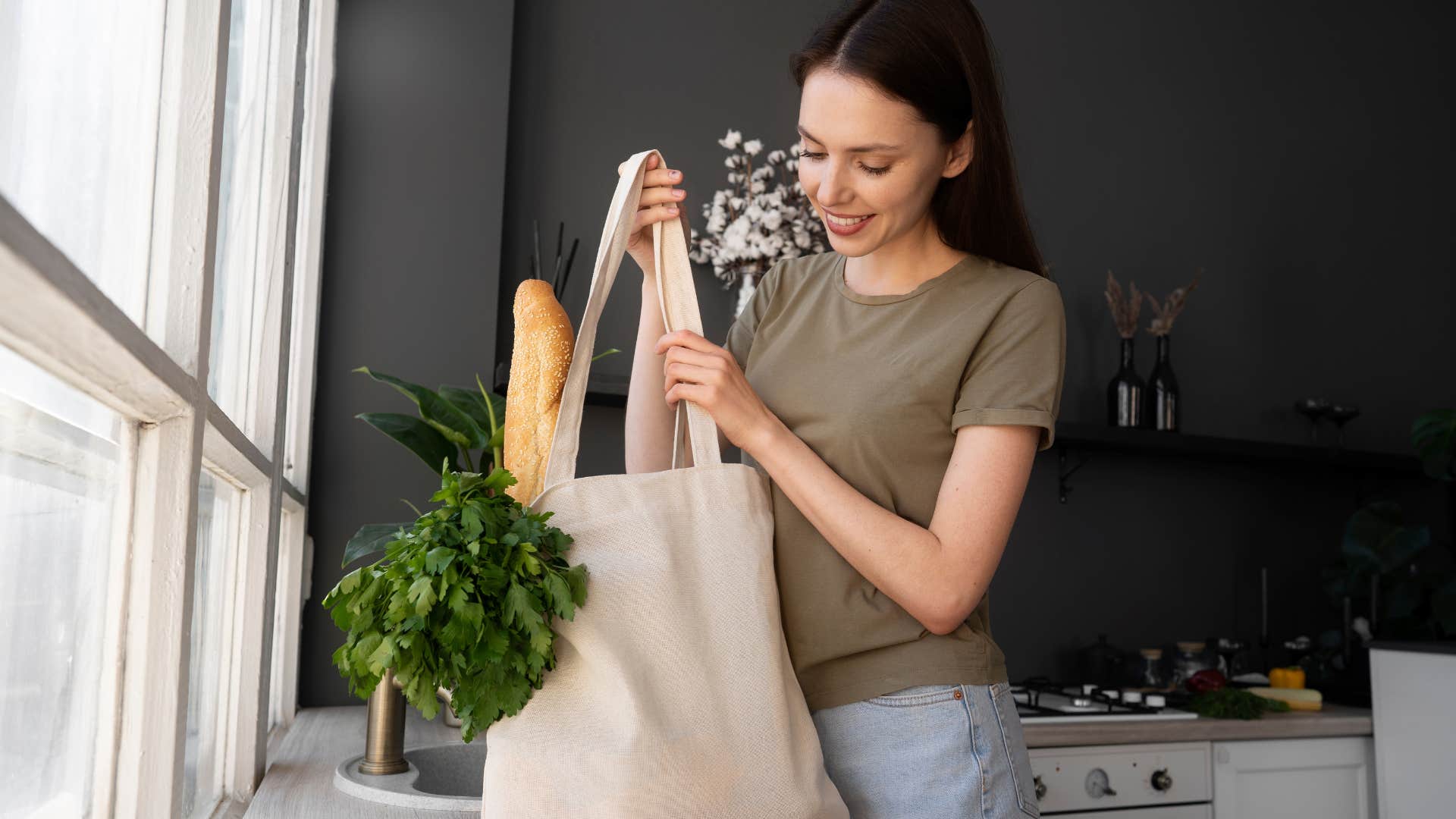 a woman uses tote bags for her groceries