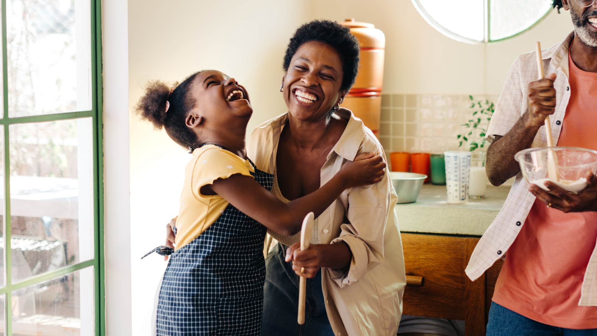 joyful mom and daughter engaging in friendly way