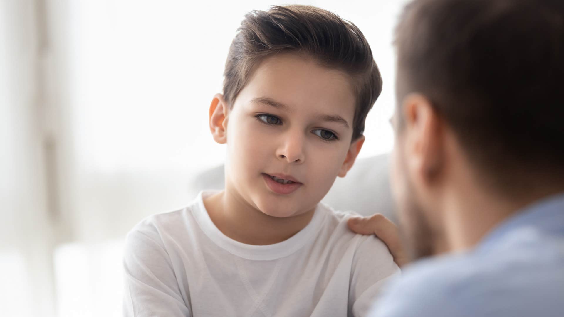 dad listening intently to son