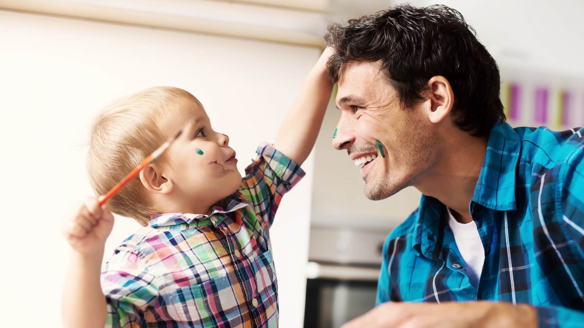 dad recognizing his sons strengths with painting creativity