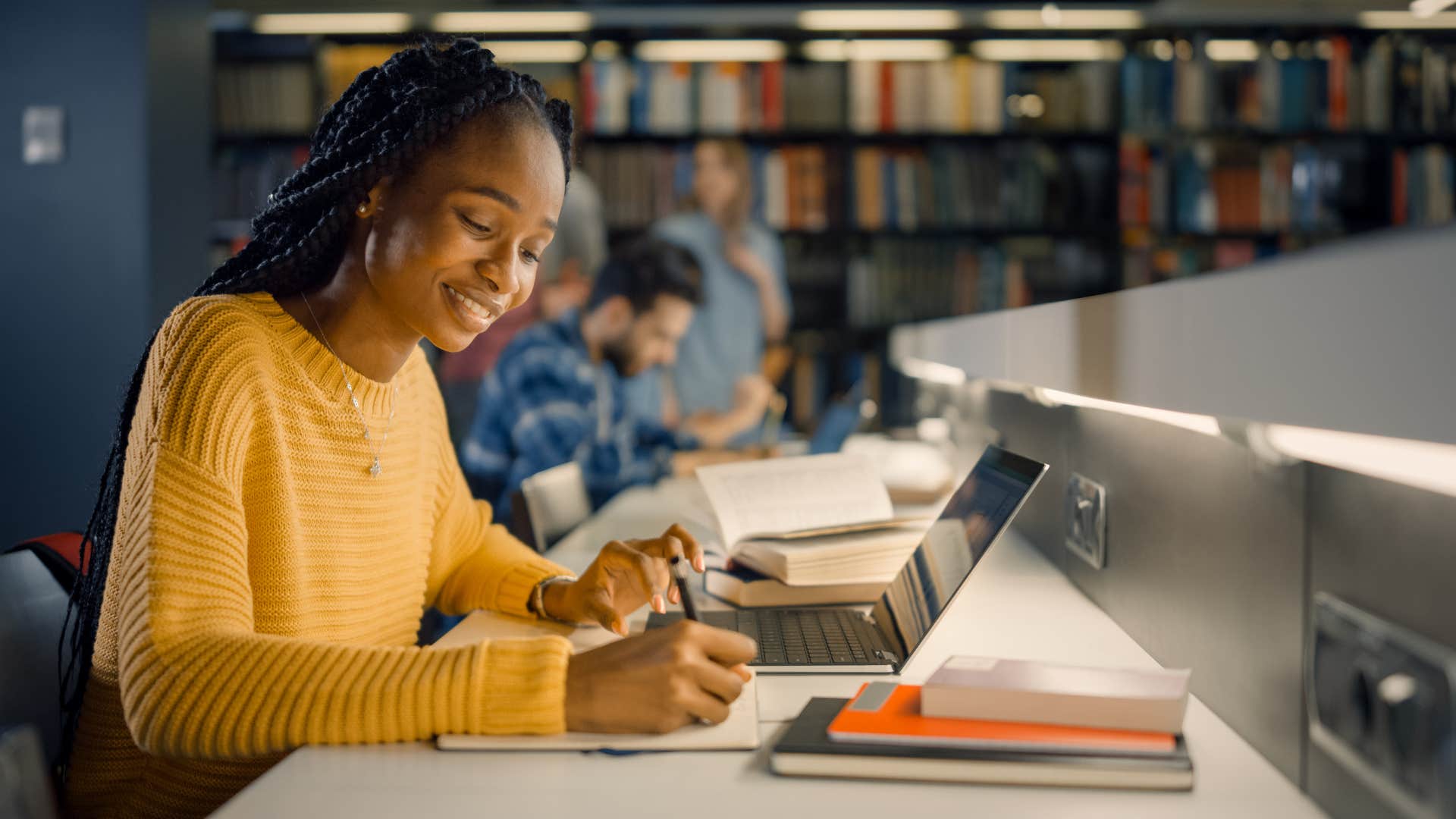 intelligent woman working hard in a library