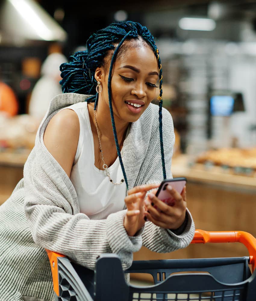 Woman doing spending audit that frugal people do to get out of debt