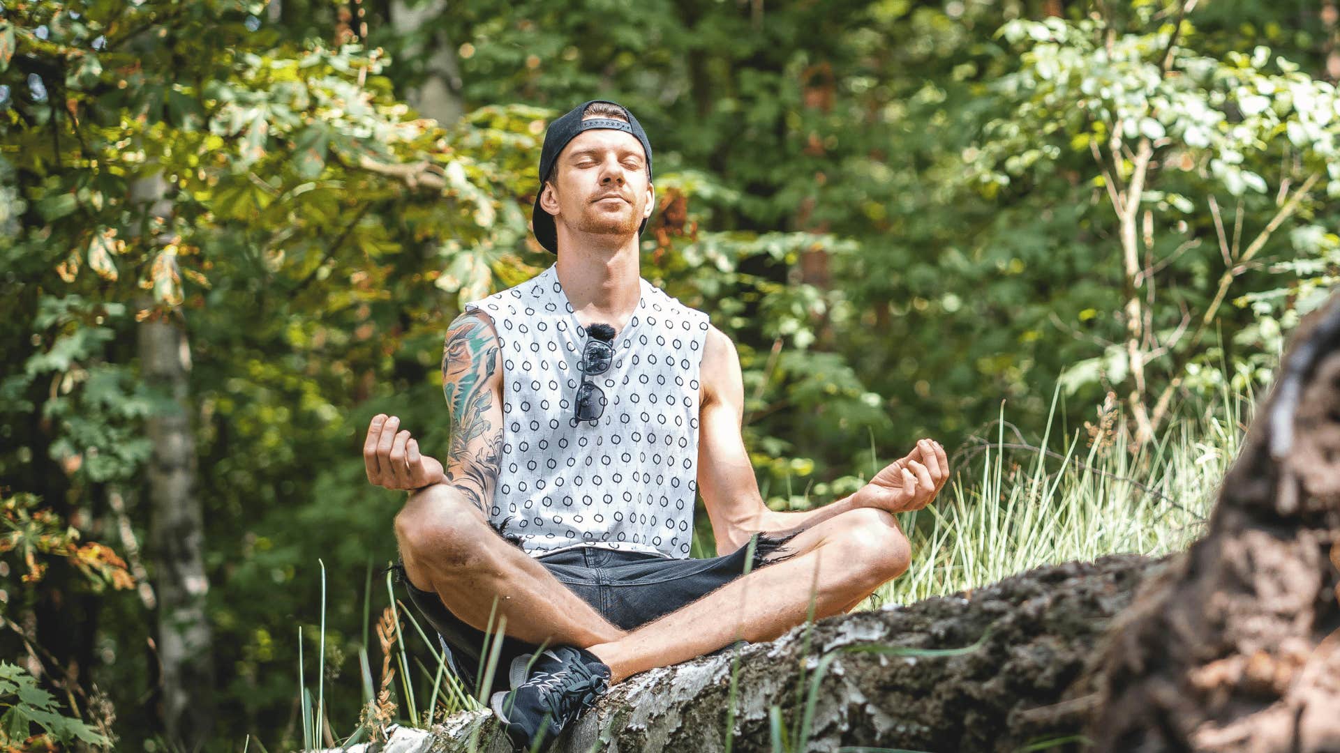 man meditating in nature to have needs met after break up