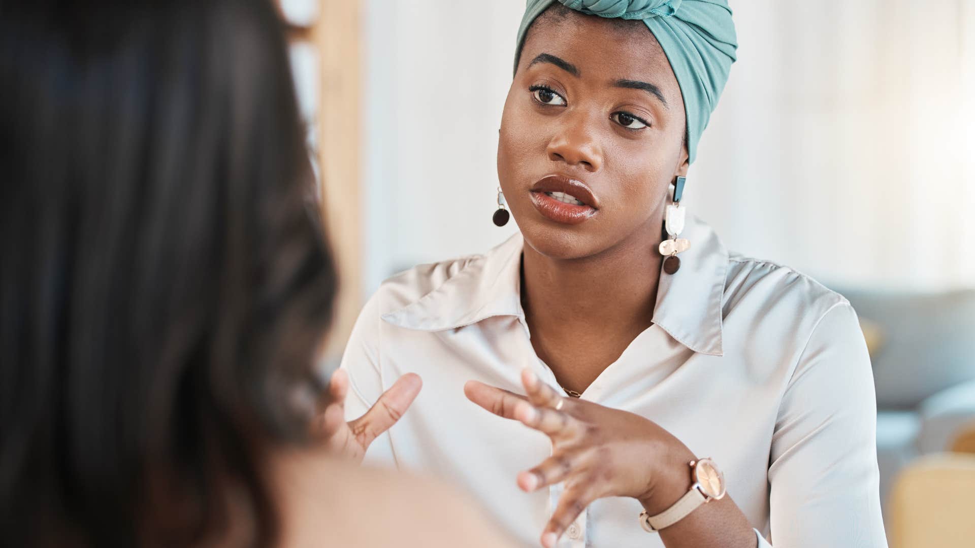 woman speaking to boss at work