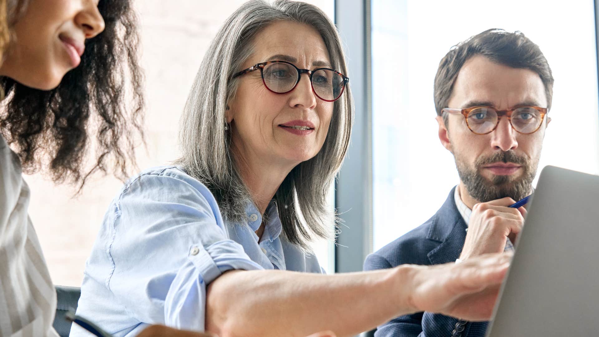 boss talking to employees at work