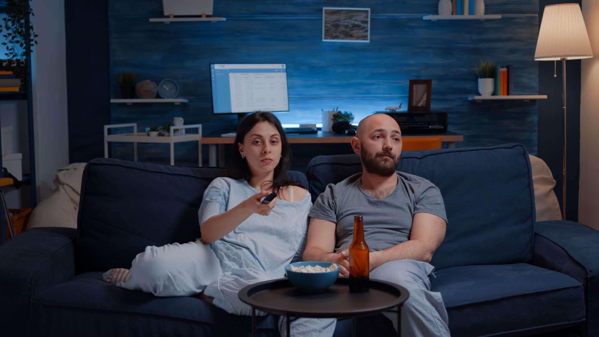 couple watching the news upset by current events