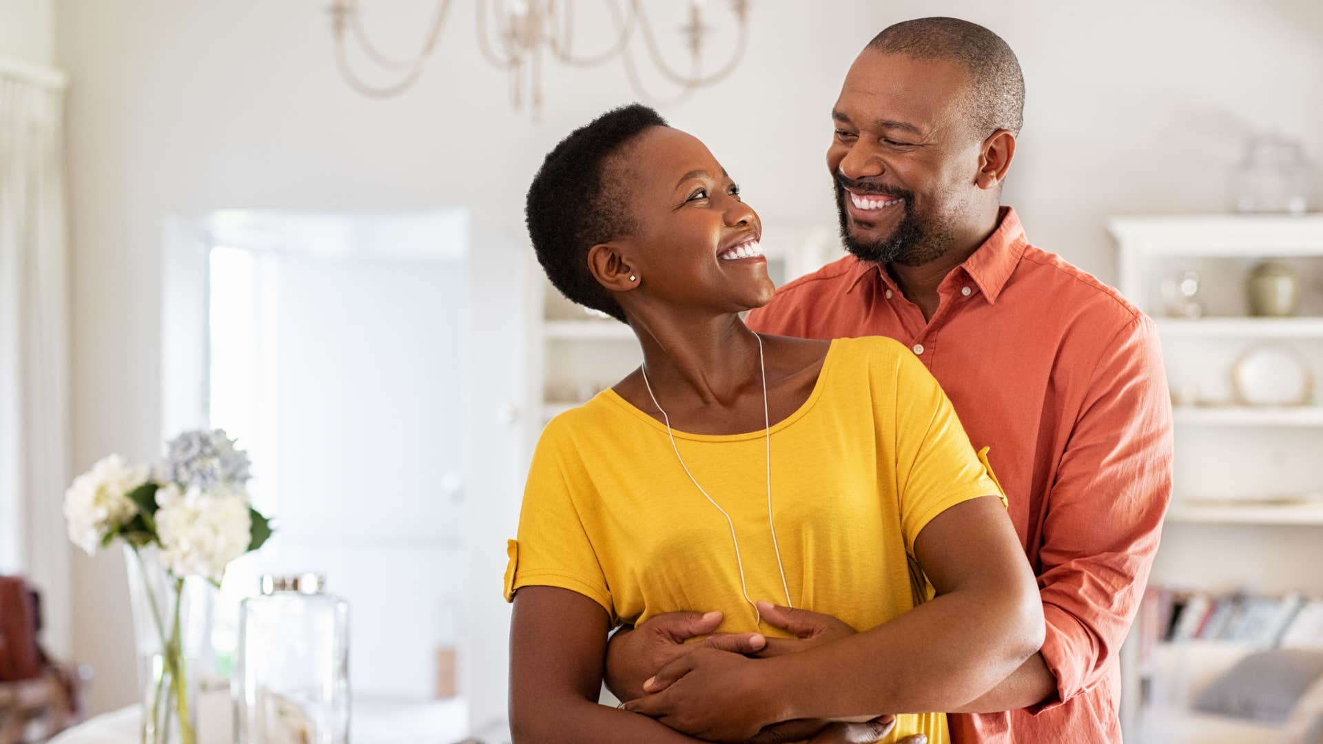 intellectually compatible couple with a similar sense of humor laughing together