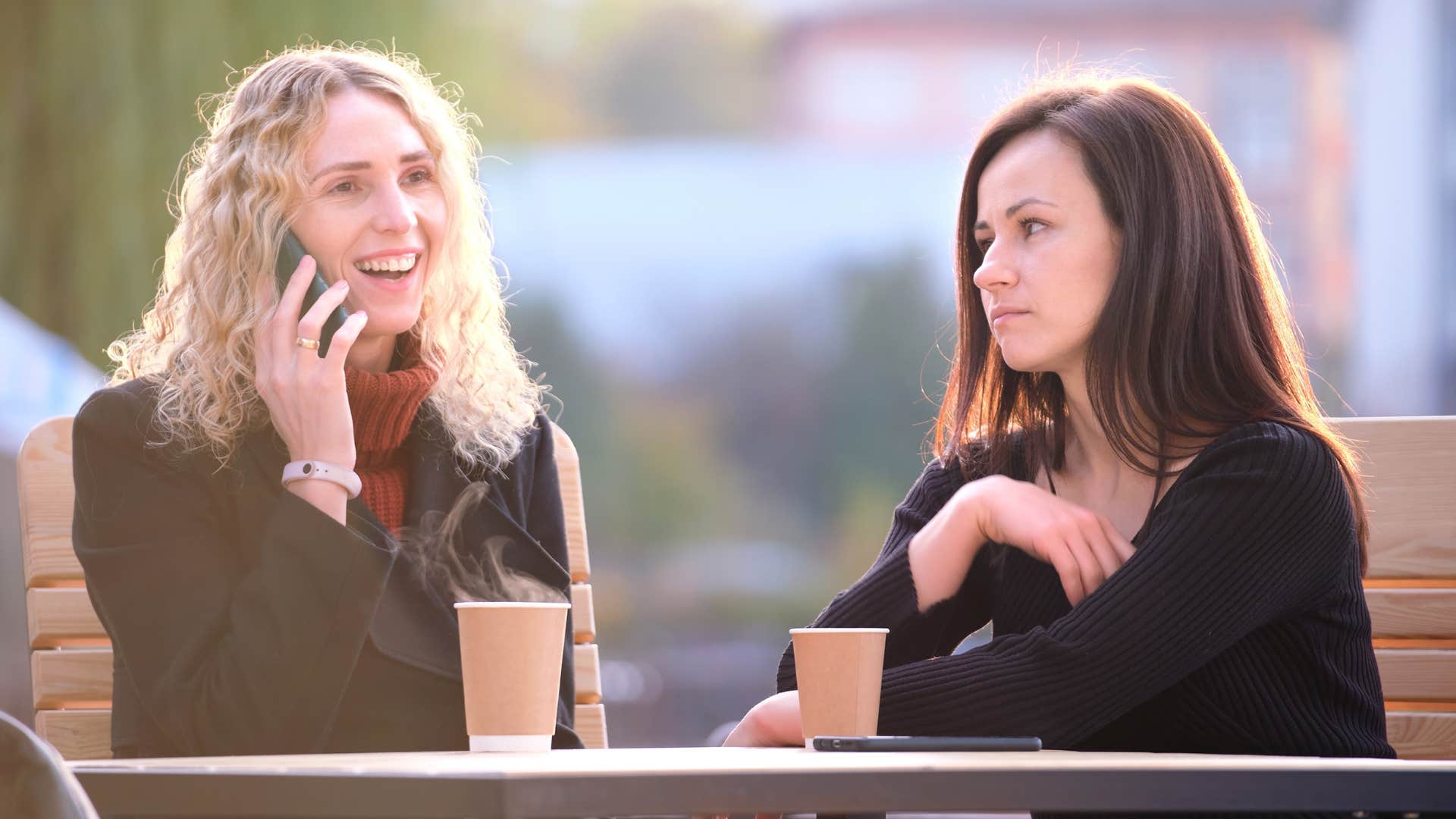woman tired of her friend gossiping talking on phone