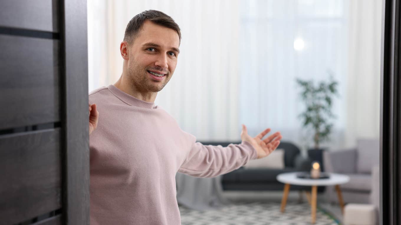 Things Boomers Instantly Notice When They Enter A Gen Zer's Home young gen z man welcoming boomer parents into his home