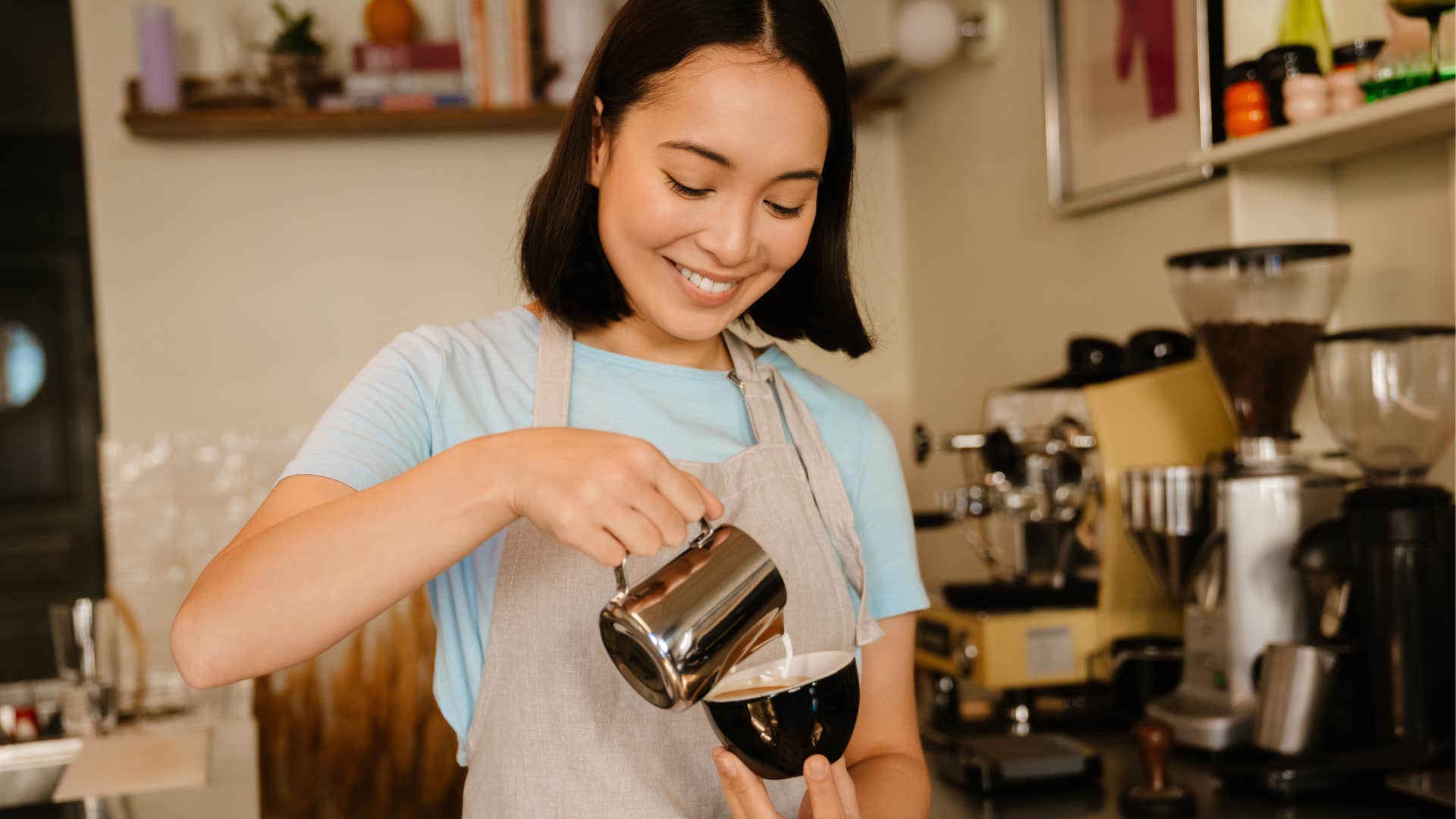 gen z woman making a coffee with an expensive espresso machine